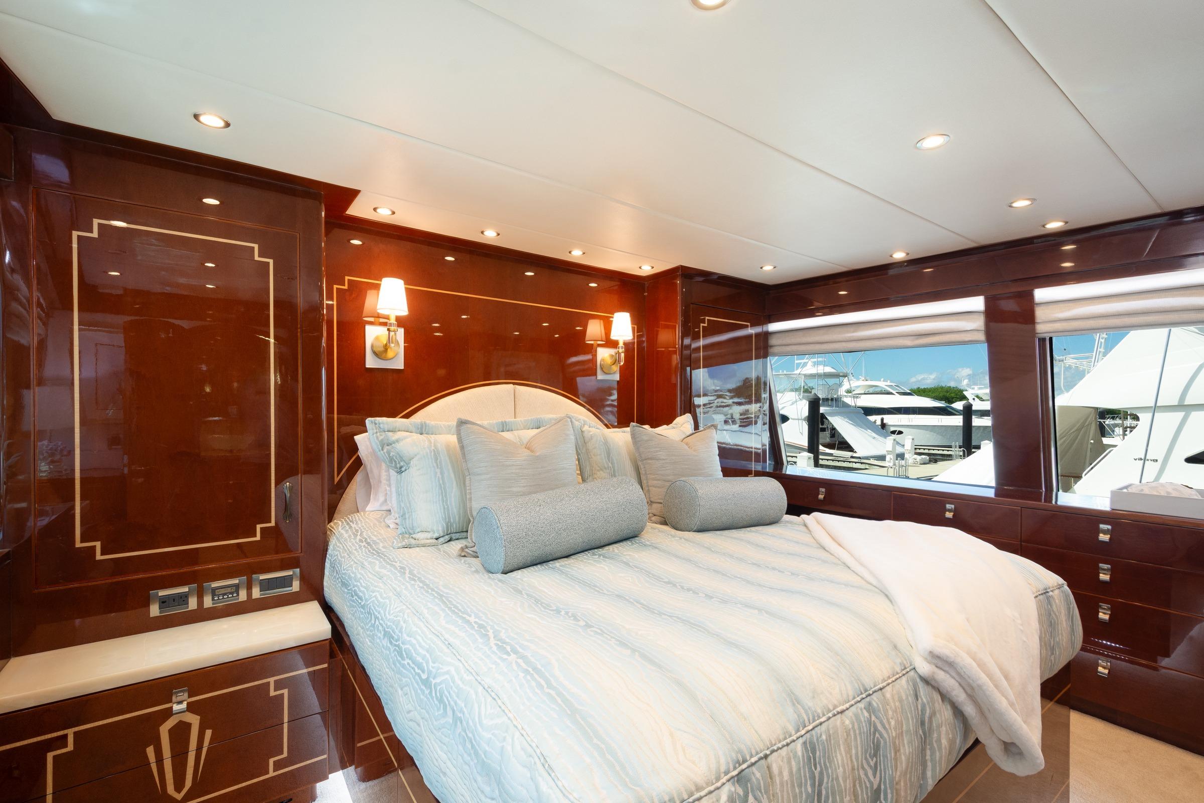 Luxurious bedroom interior on 2014 Hargrave Sky Lounge yacht with elegant wood paneling.