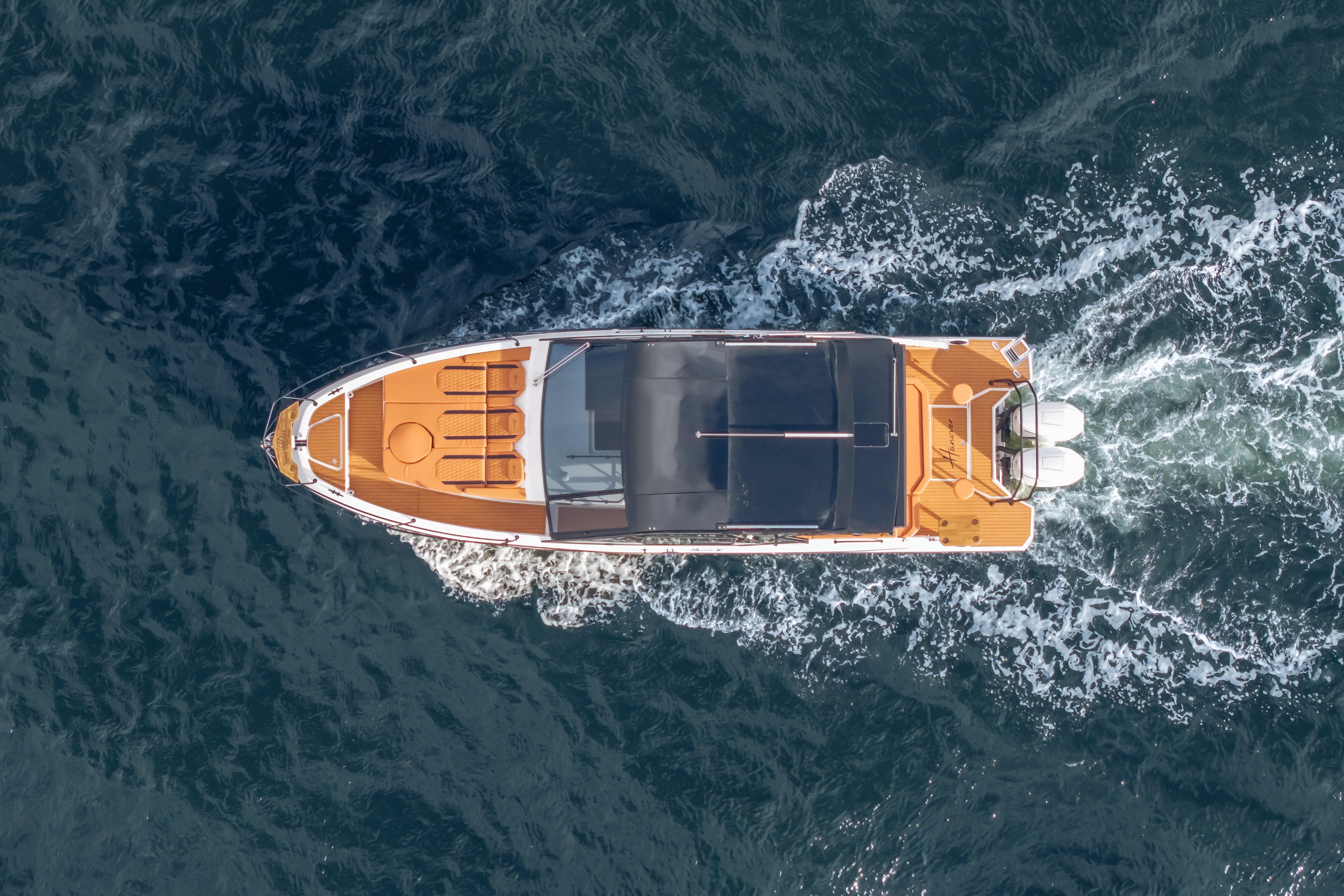 Aerial view of 2026 Hanover 387 boat cruising on open water.