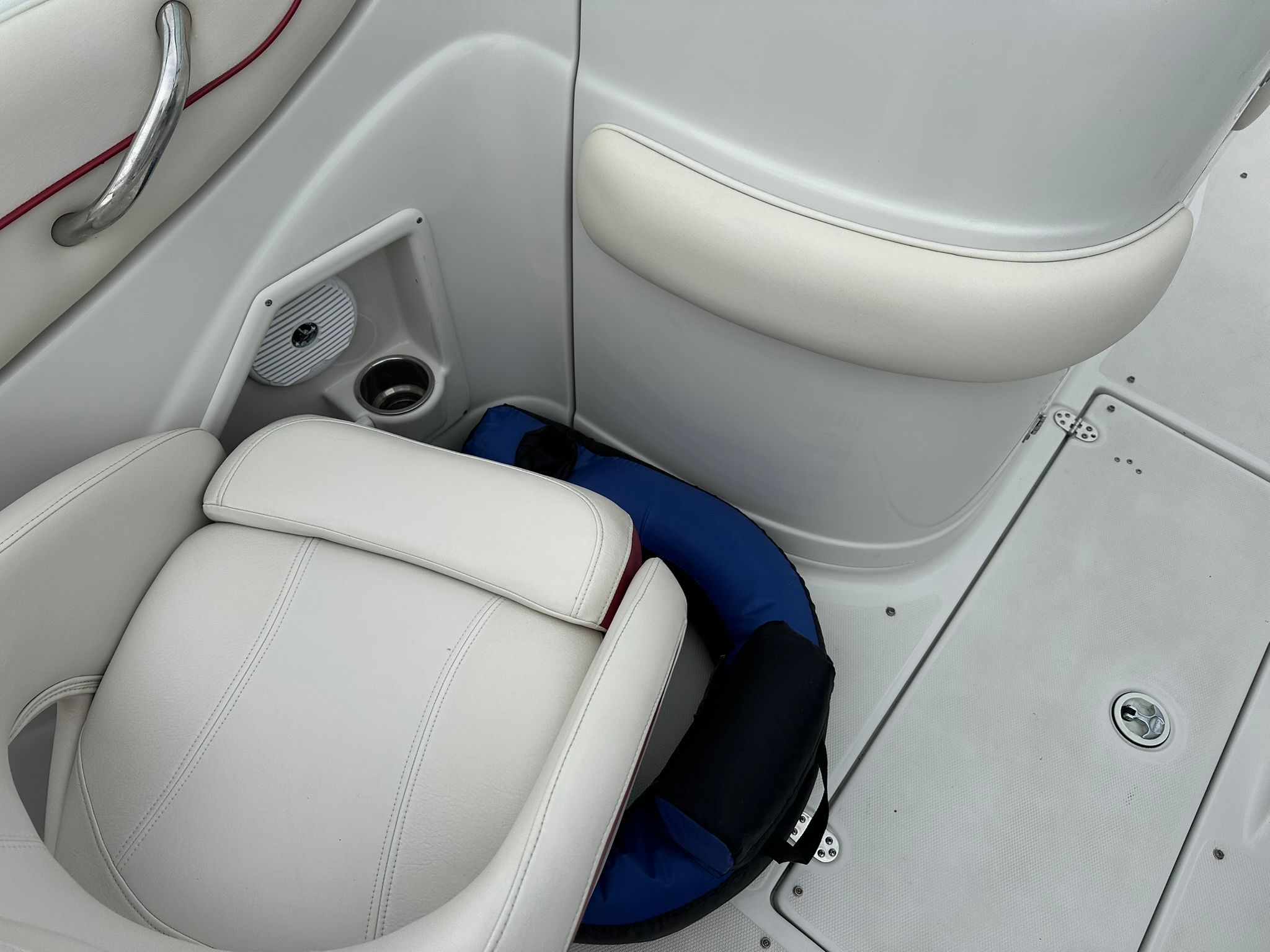 Interior of a 2009 Crownline 220 EX boat with white seating and blue accents.
