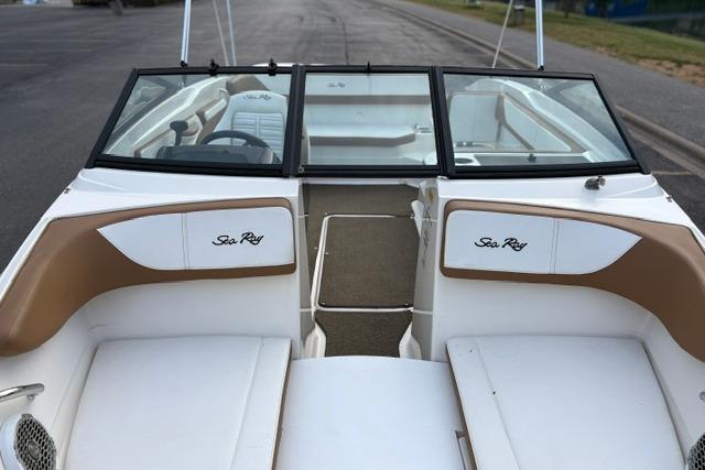 2017 Searay SPX210 boat interior with tan and white seating, open deck view.