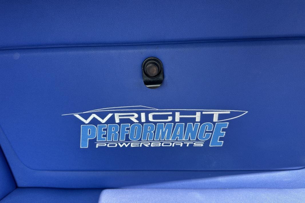 Blue interior of 2018 Wright Performance 420 powerboat with logo.
