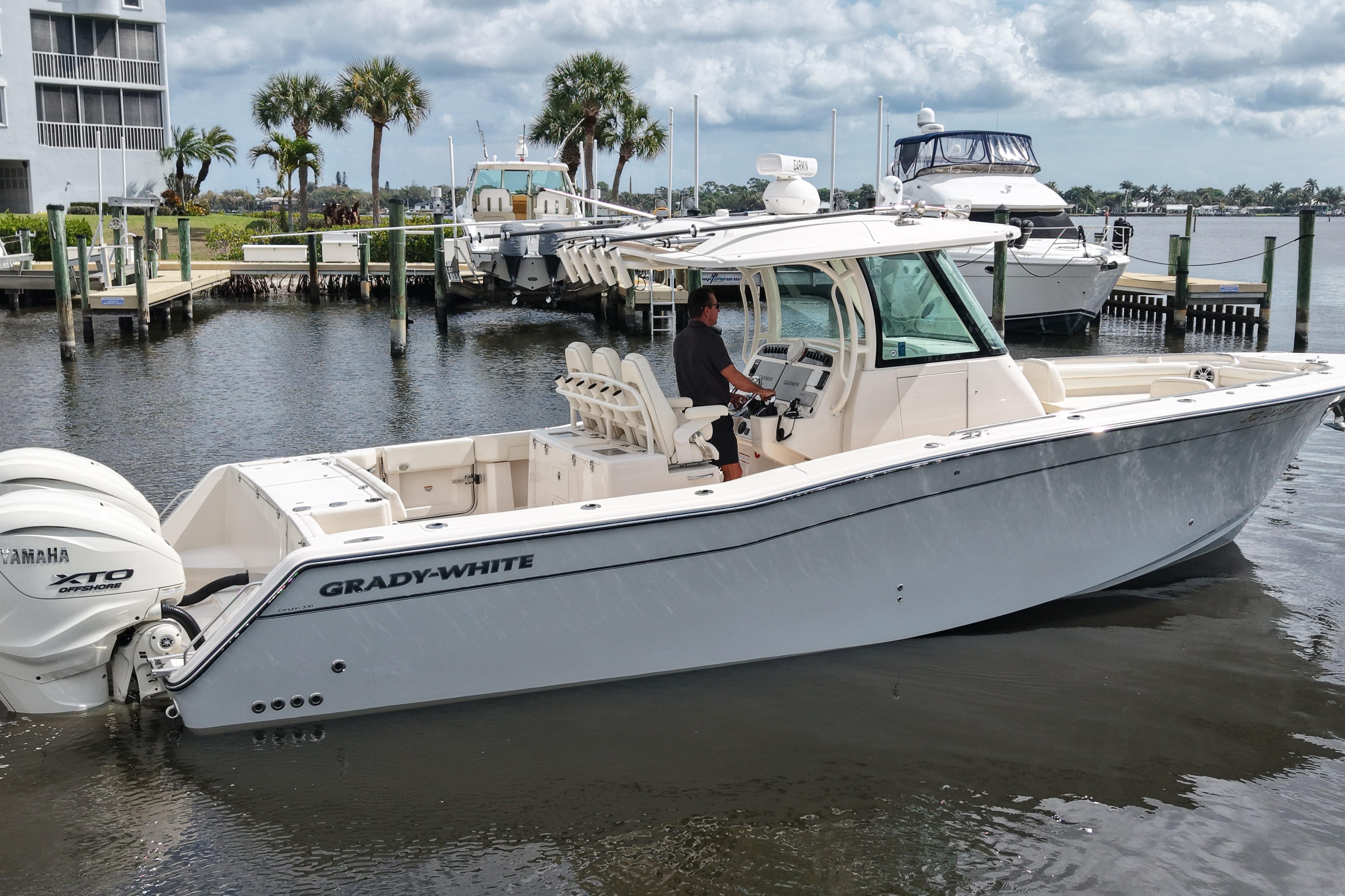 2024 Grady-White Canyon 336 boat docked, featuring Yamaha XTO engines.