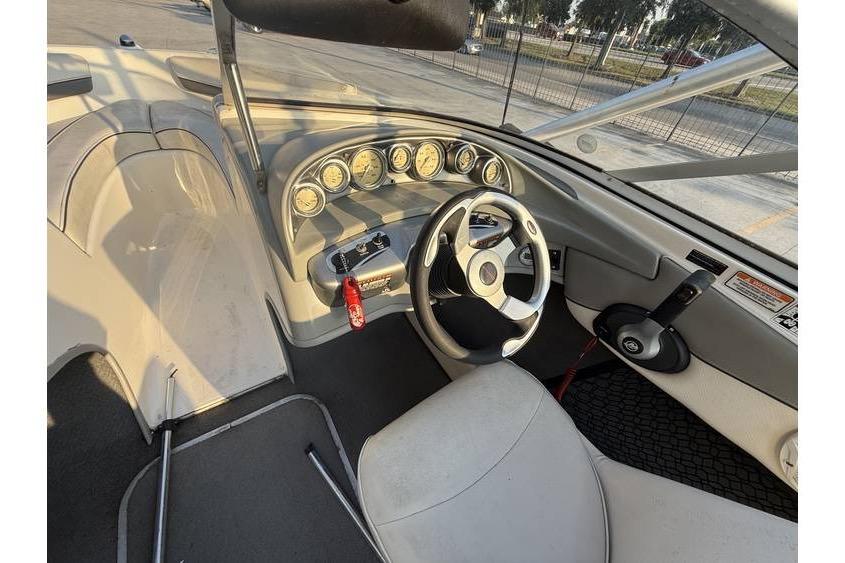 2008 Bayliner 185 Bowrider dashboard with steering wheel and instrument panel.