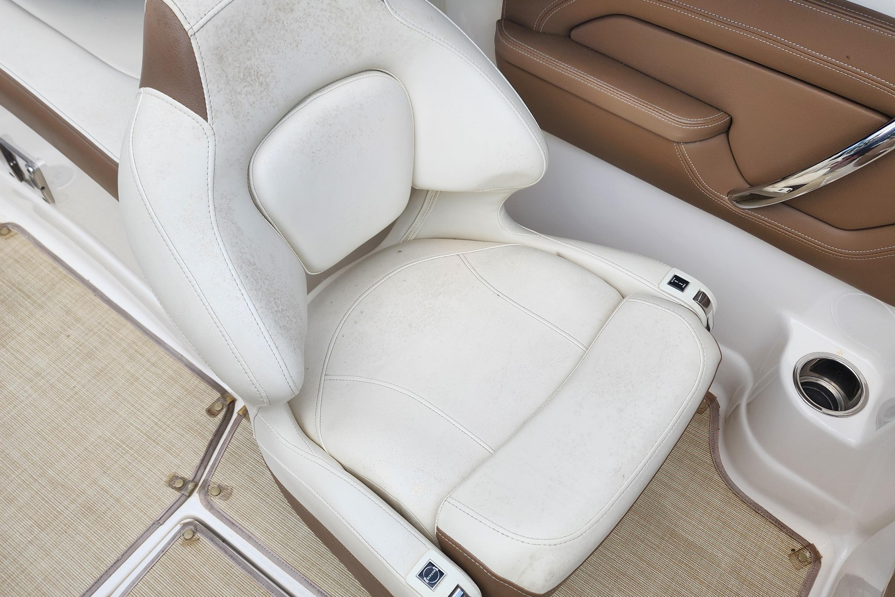 2015 Chaparral 224 Sunesta boat seat, white and brown leather, interior detail.