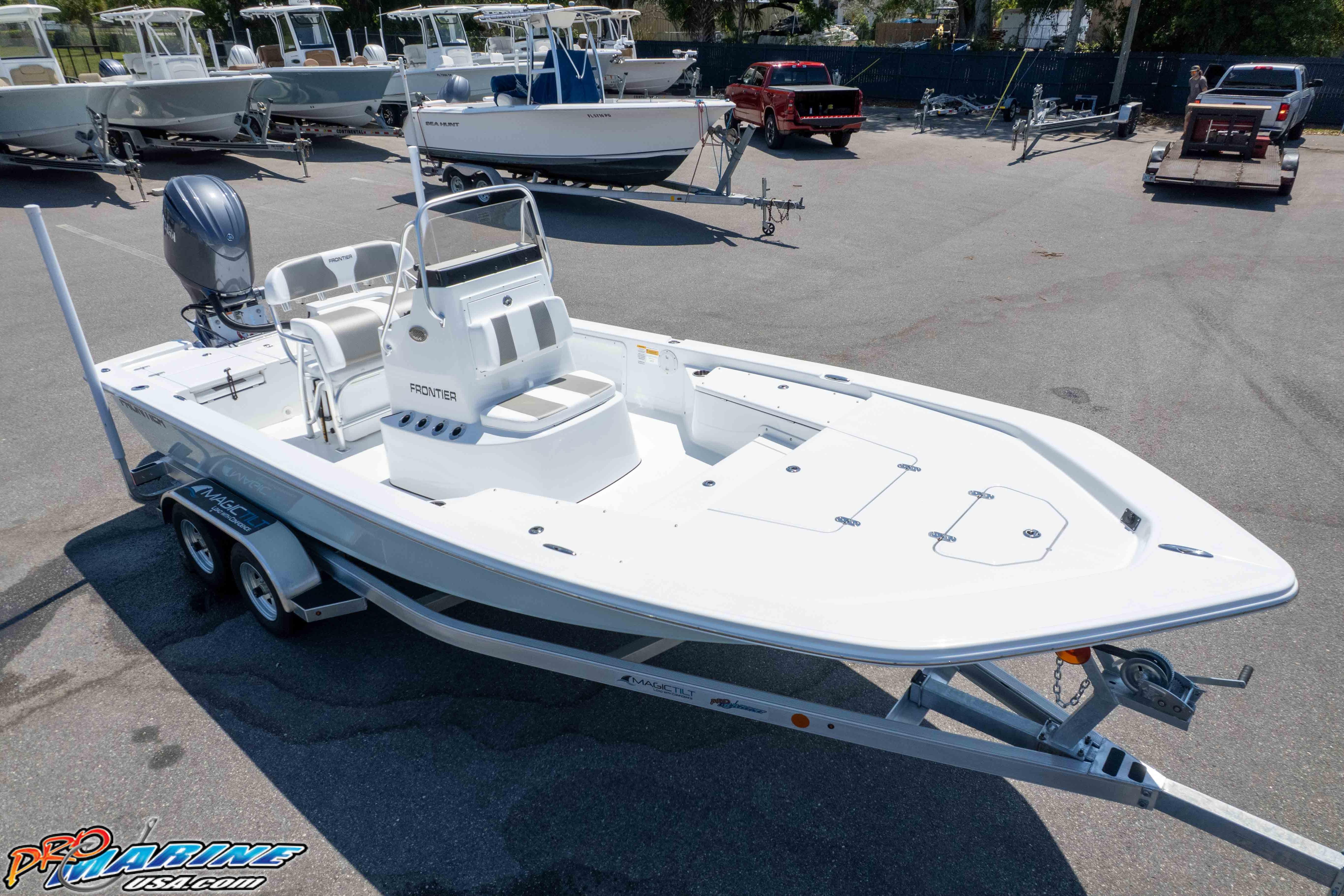 2026 Frontier 180 boat on trailer in marina parking lot.