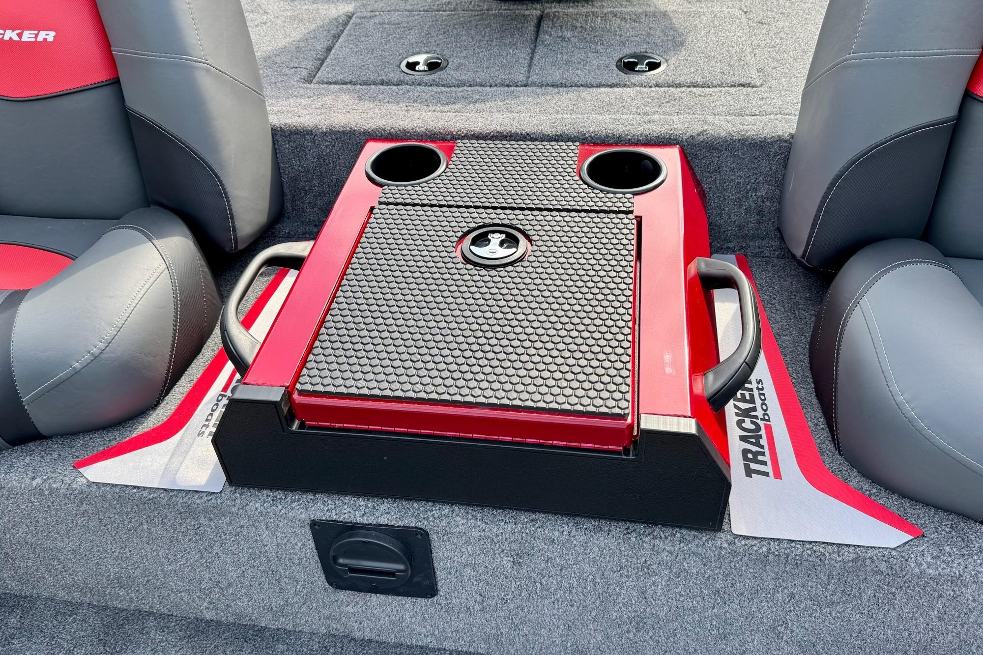 2026 Tracker Savage 215 boat interior with red and black console, cup holders, and seating.