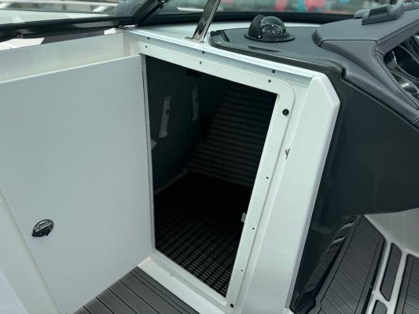 Open storage compartment on a 2018 Monterey 258 Super Sport boat.