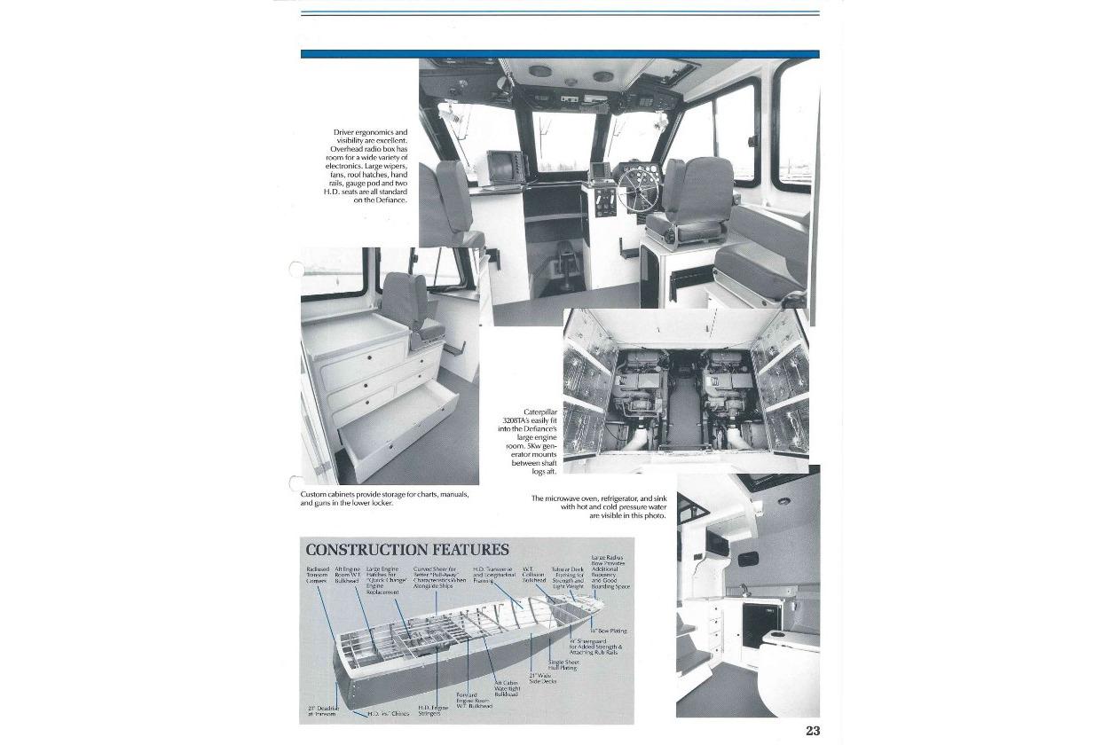 1990 Boston Whaler 36 Defiance interior and construction features, showcasing helm, storage, and engine layout.