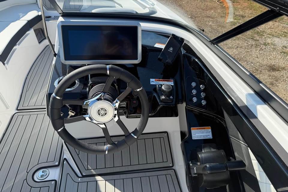 2026 Yamaha Boats 252S dashboard with steering wheel and touchscreen display.