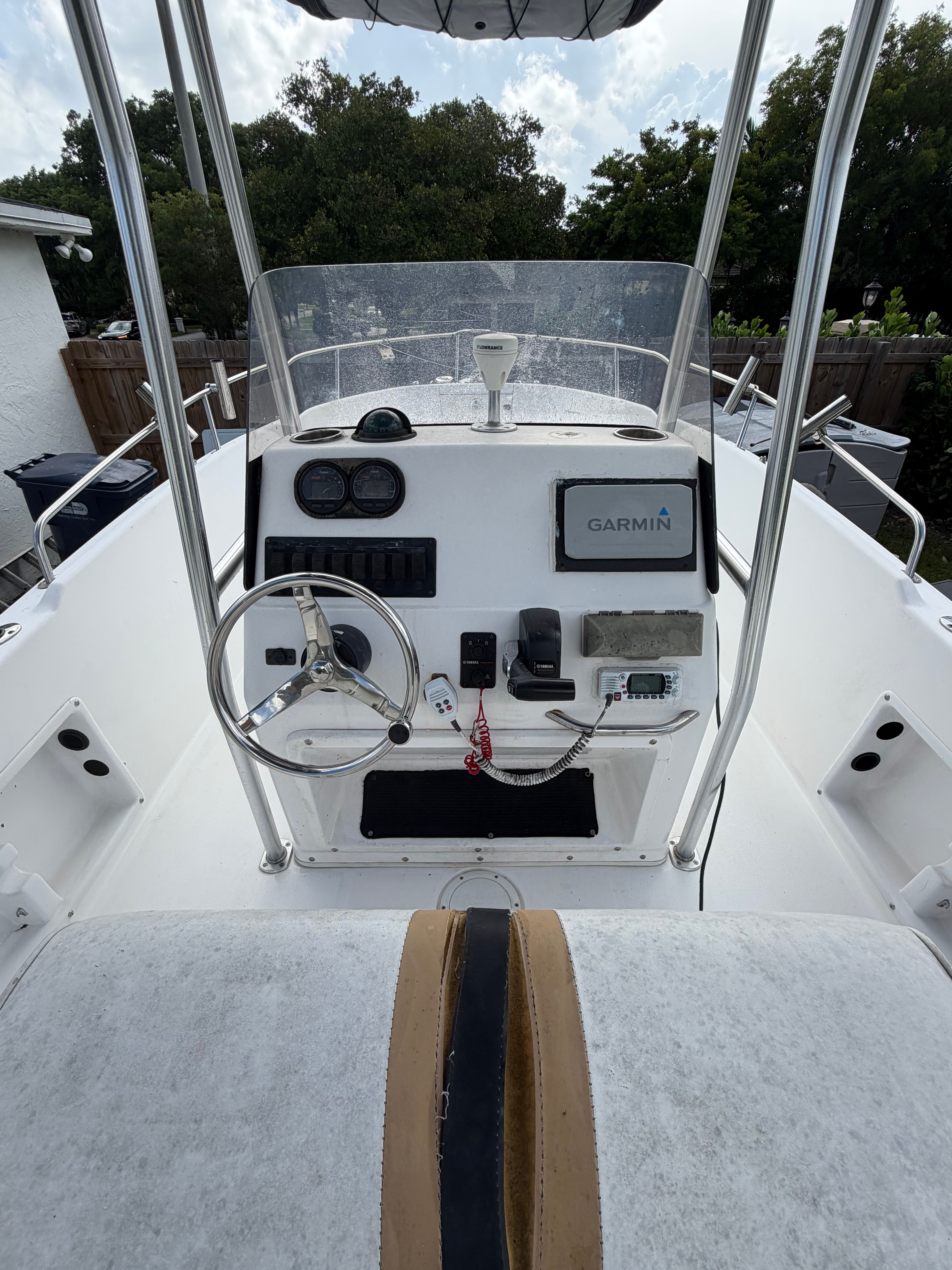 The image shows the helm of a 2001 Century 2100 Center Console boat with Garmin equipment.