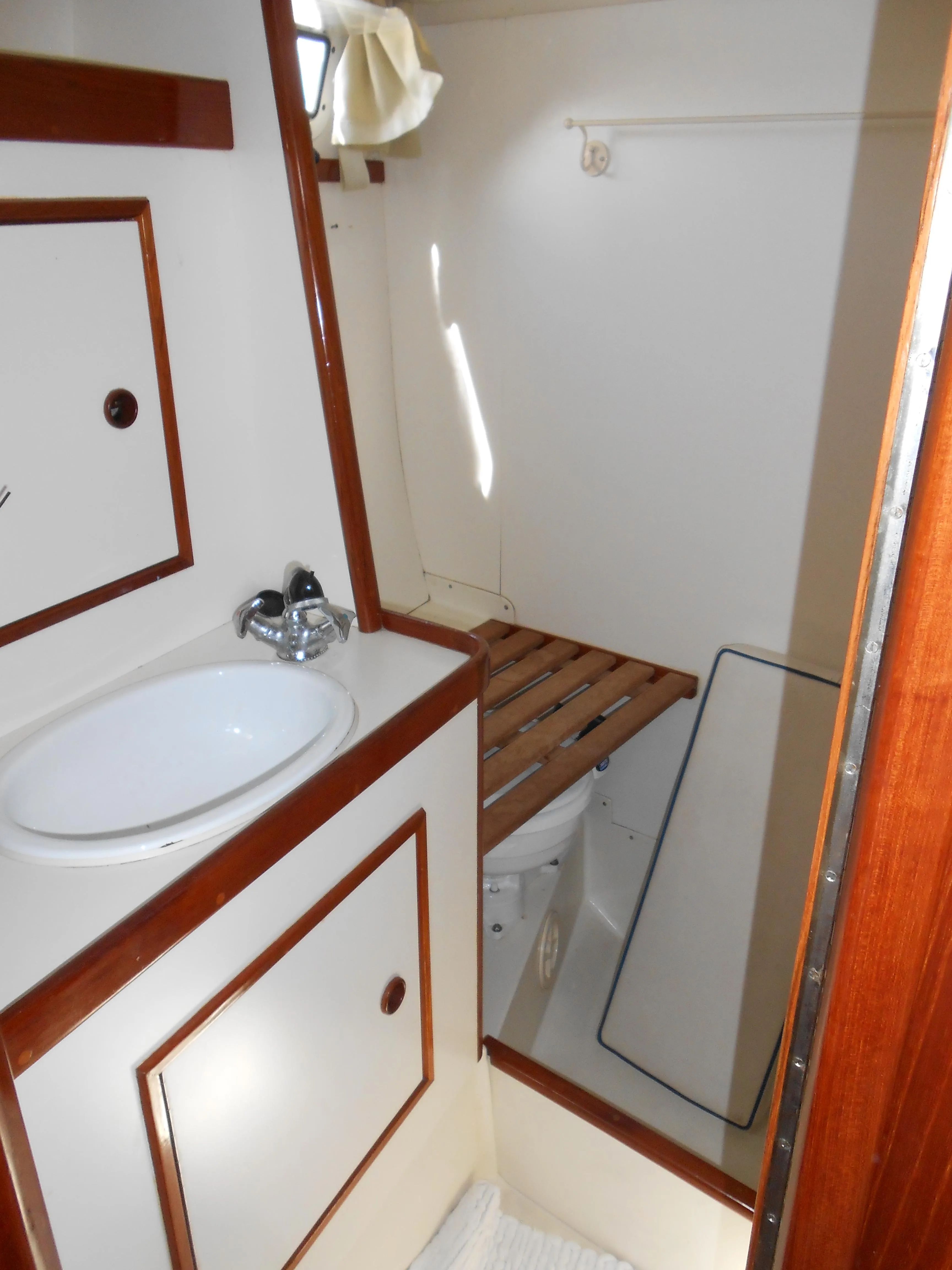 Interior of a 1985 Contest 41 Ketch yacht with sink and toilet.