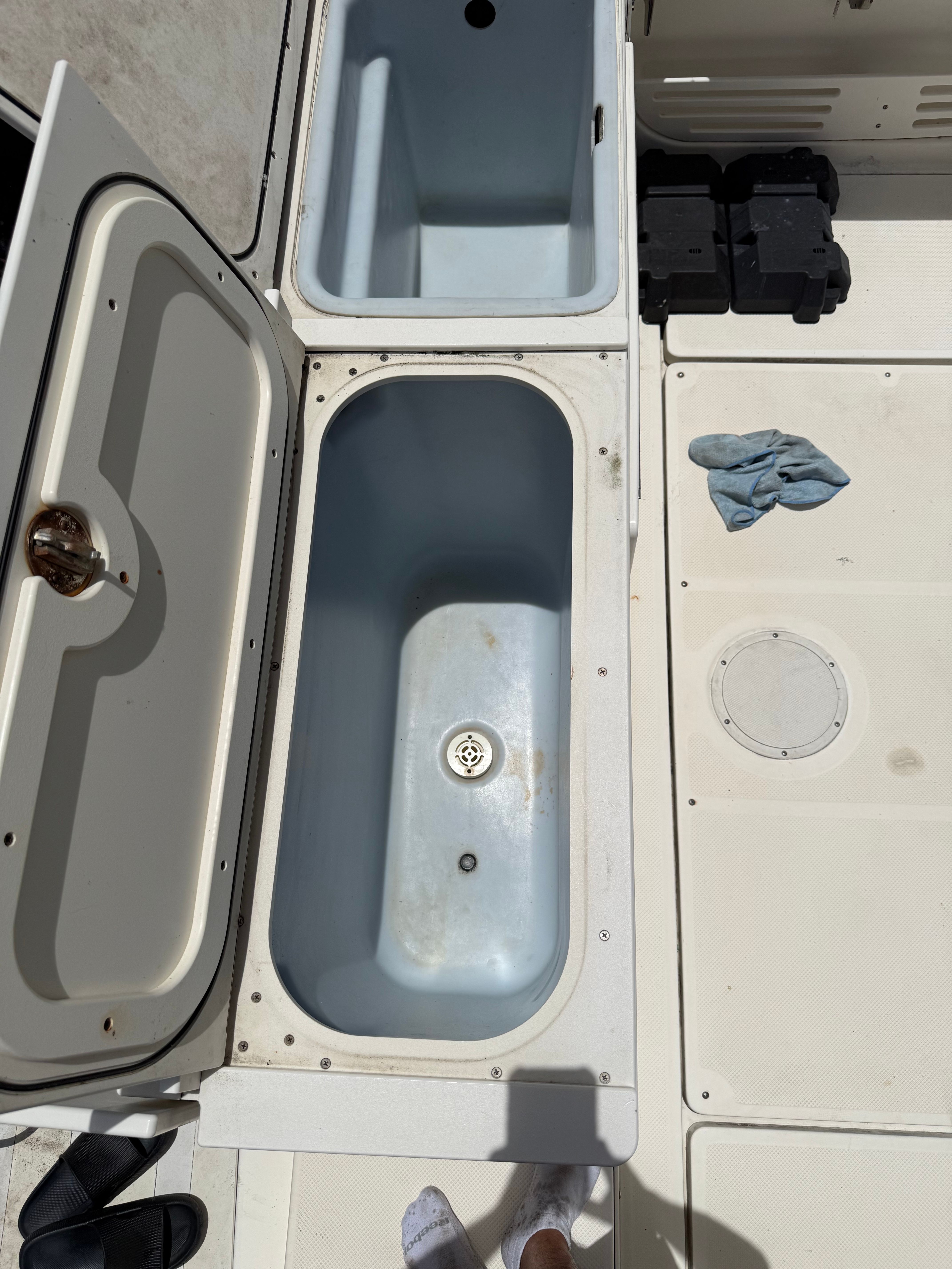Open storage compartment on a 2005 Trophy 2902 Walkaround boat.