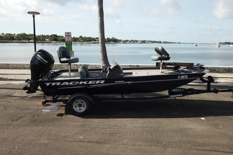 2020 Tracker Pro 170 boat on trailer by waterfront, featuring Mercury engine.