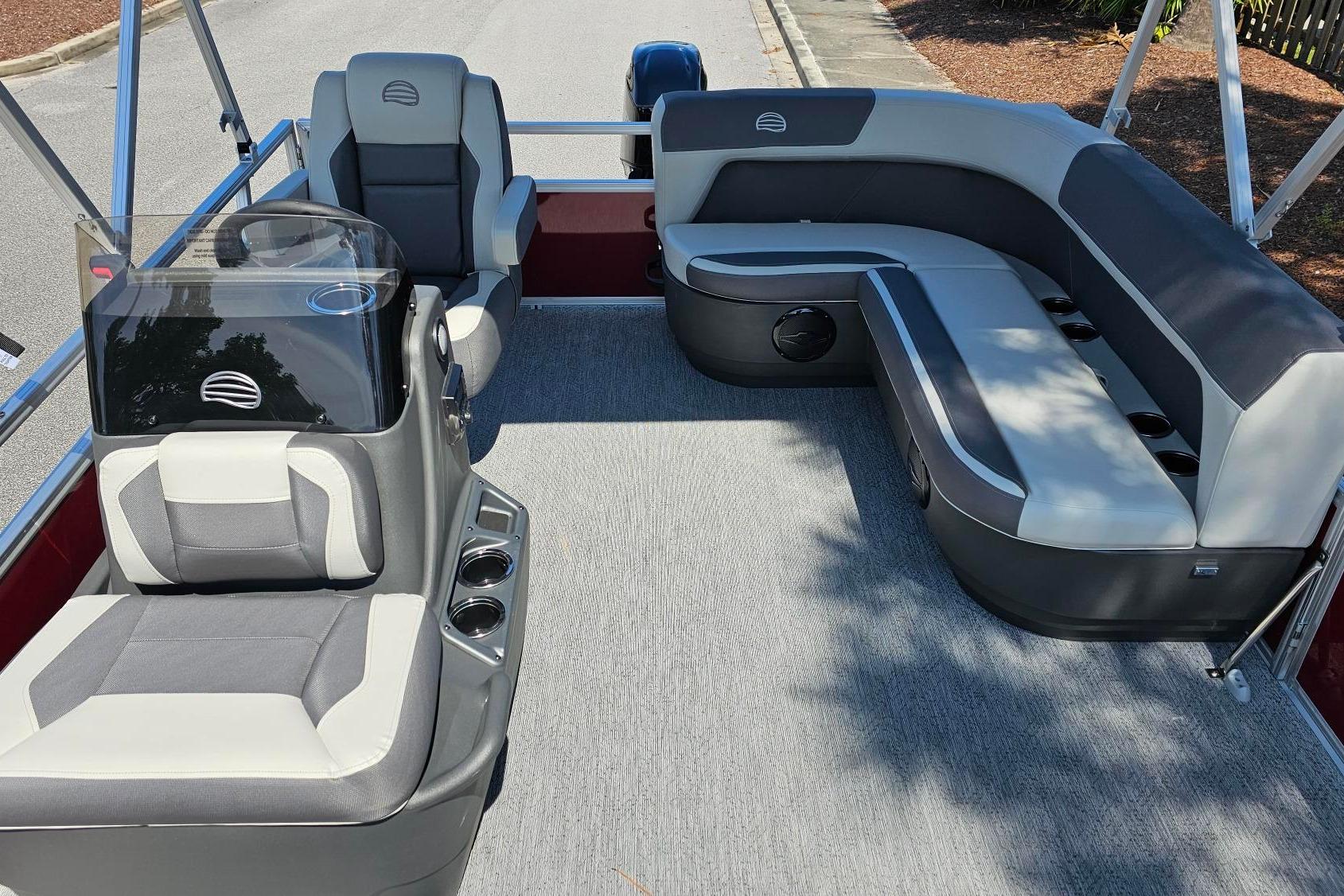 2026 Sun Tracker Bass Buggy 16 XL Select pontoon boat interior with seating and console.