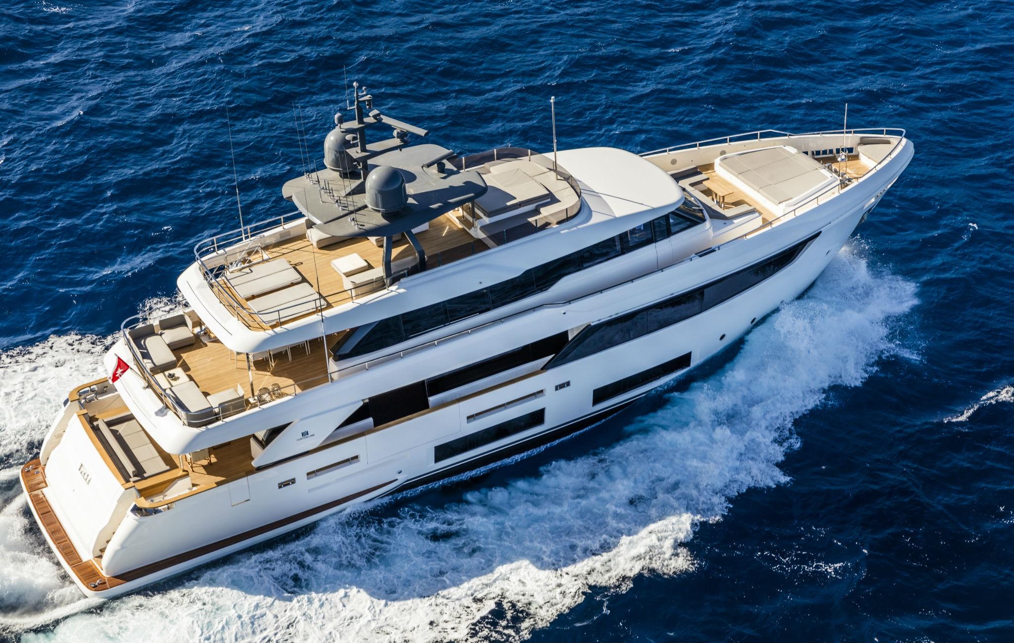Luxurious 2023 Custom Line Navetta 33 yacht cruising on open sea.