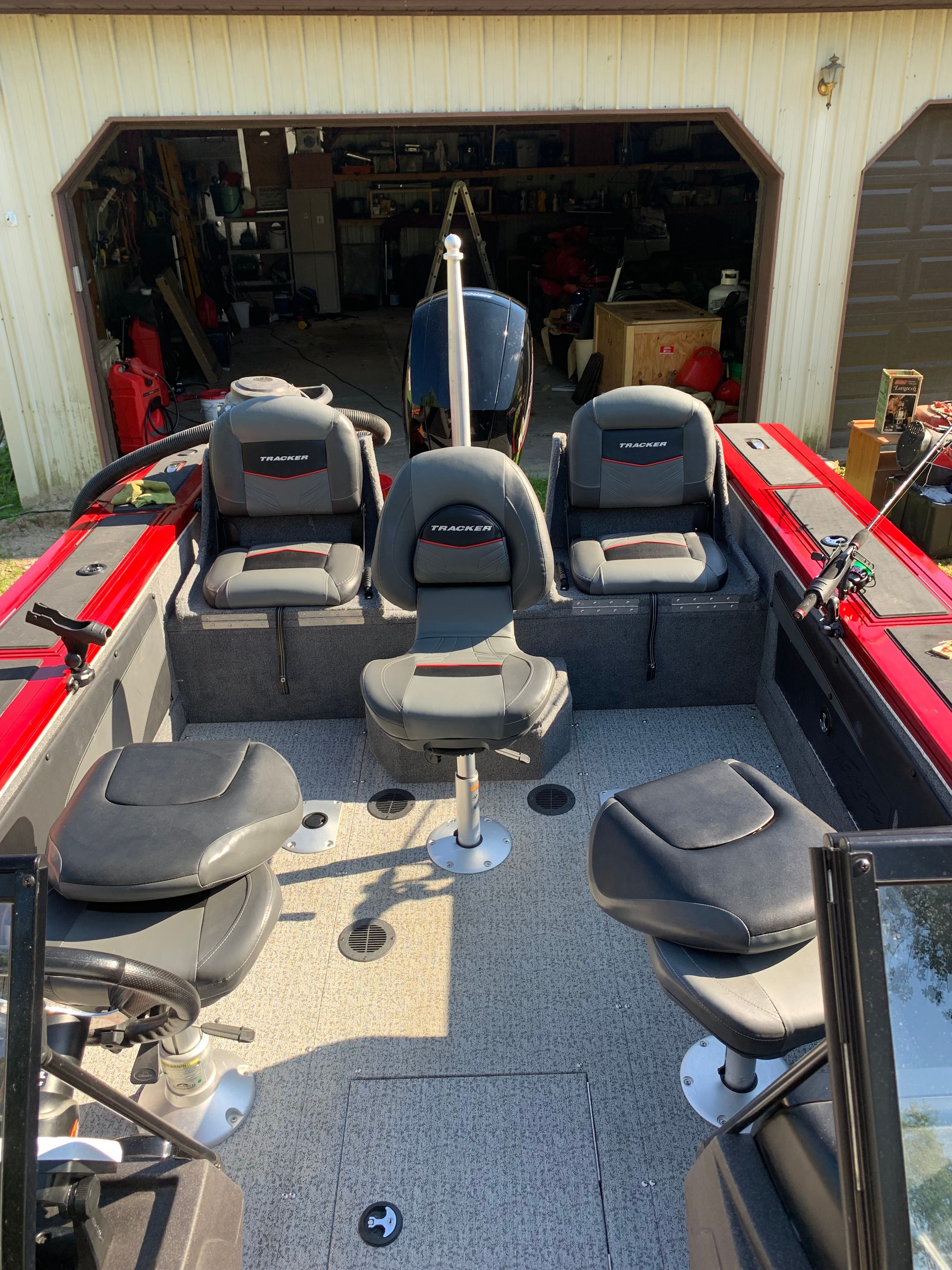 Interior view of a 2022 Tracker Targa V-19 WT boat in a garage.