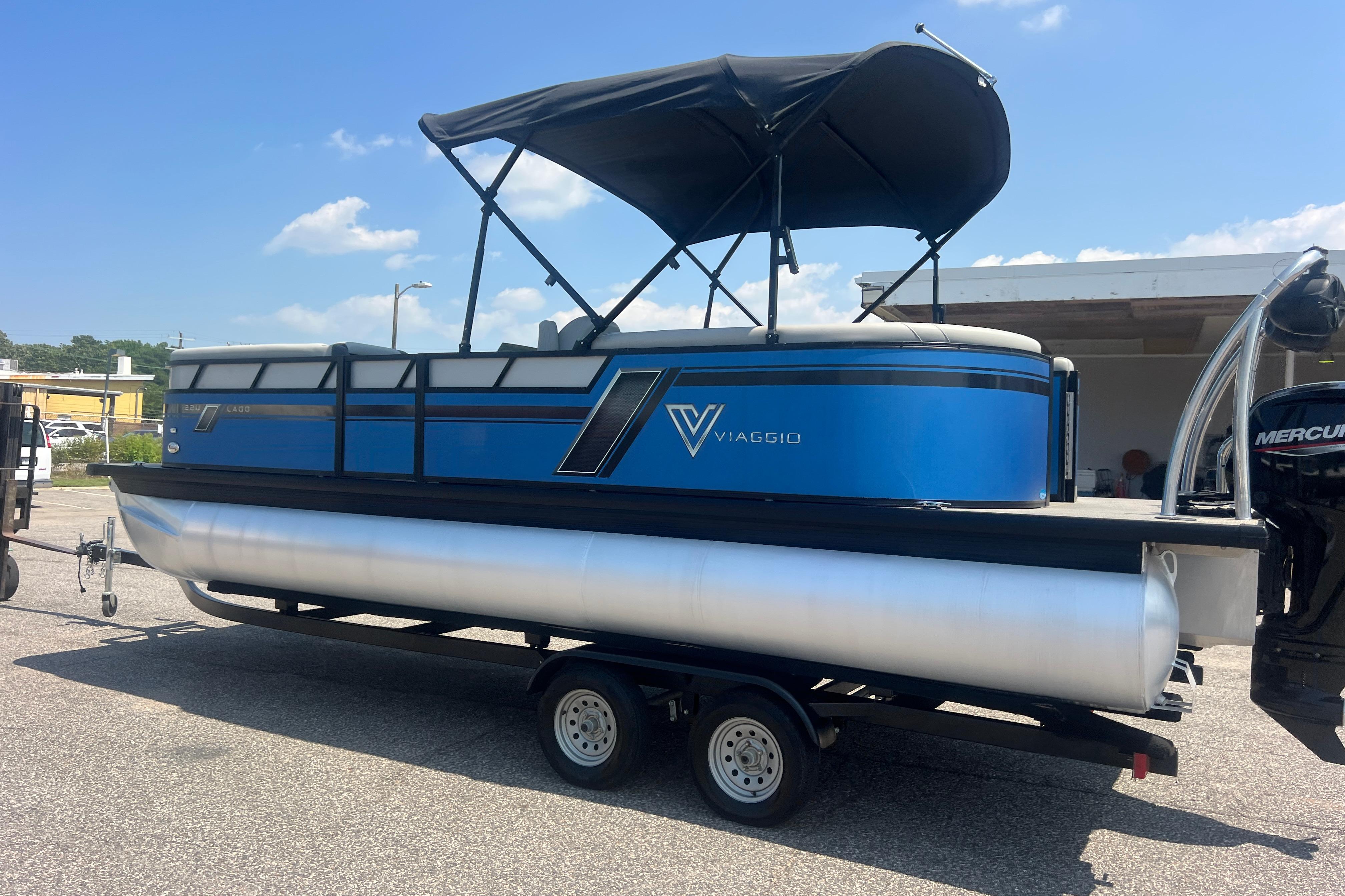 2022 Viaggio Lago V-U 22 pontoon boat with blue exterior on a trailer.