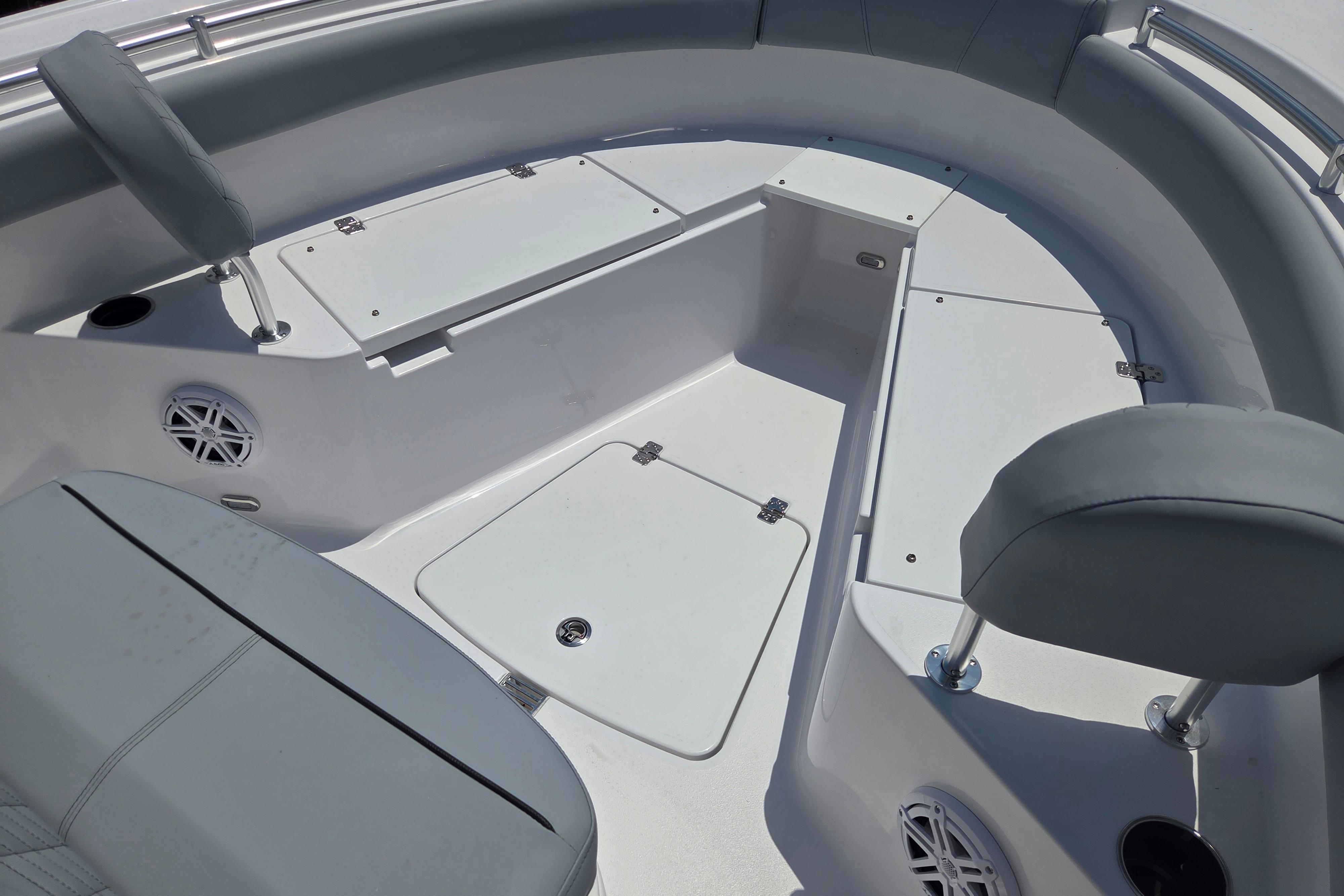 Interior view of 2026 Sportsman Open 212 Center Console boat, featuring seating and storage compartments.