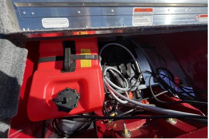 2025 Tracker Super Guide V-16 T boat interior with fuel tank and wiring.