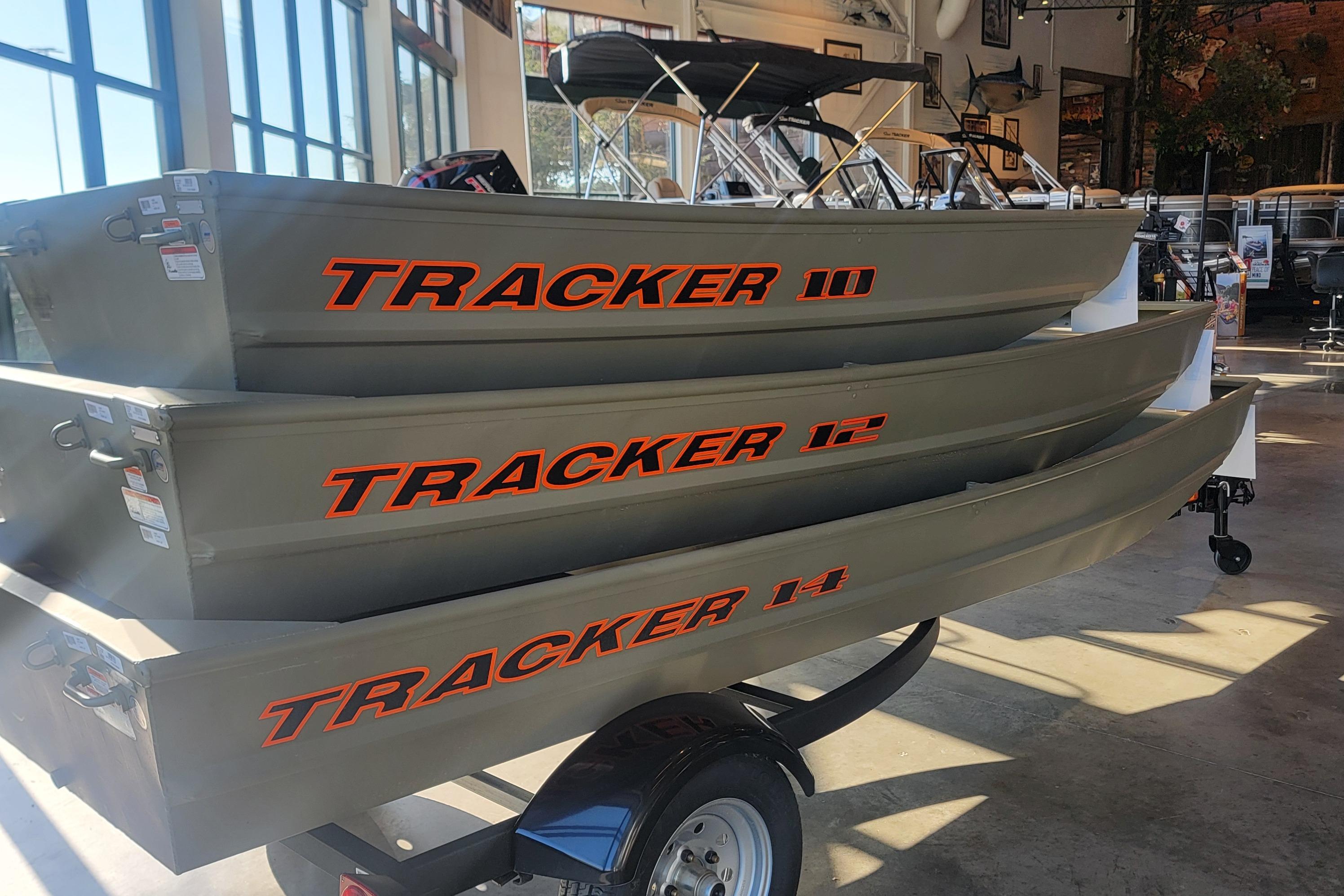 2026 Tracker Grizzly 10 Jon boats stacked in showroom, showcasing durable design.