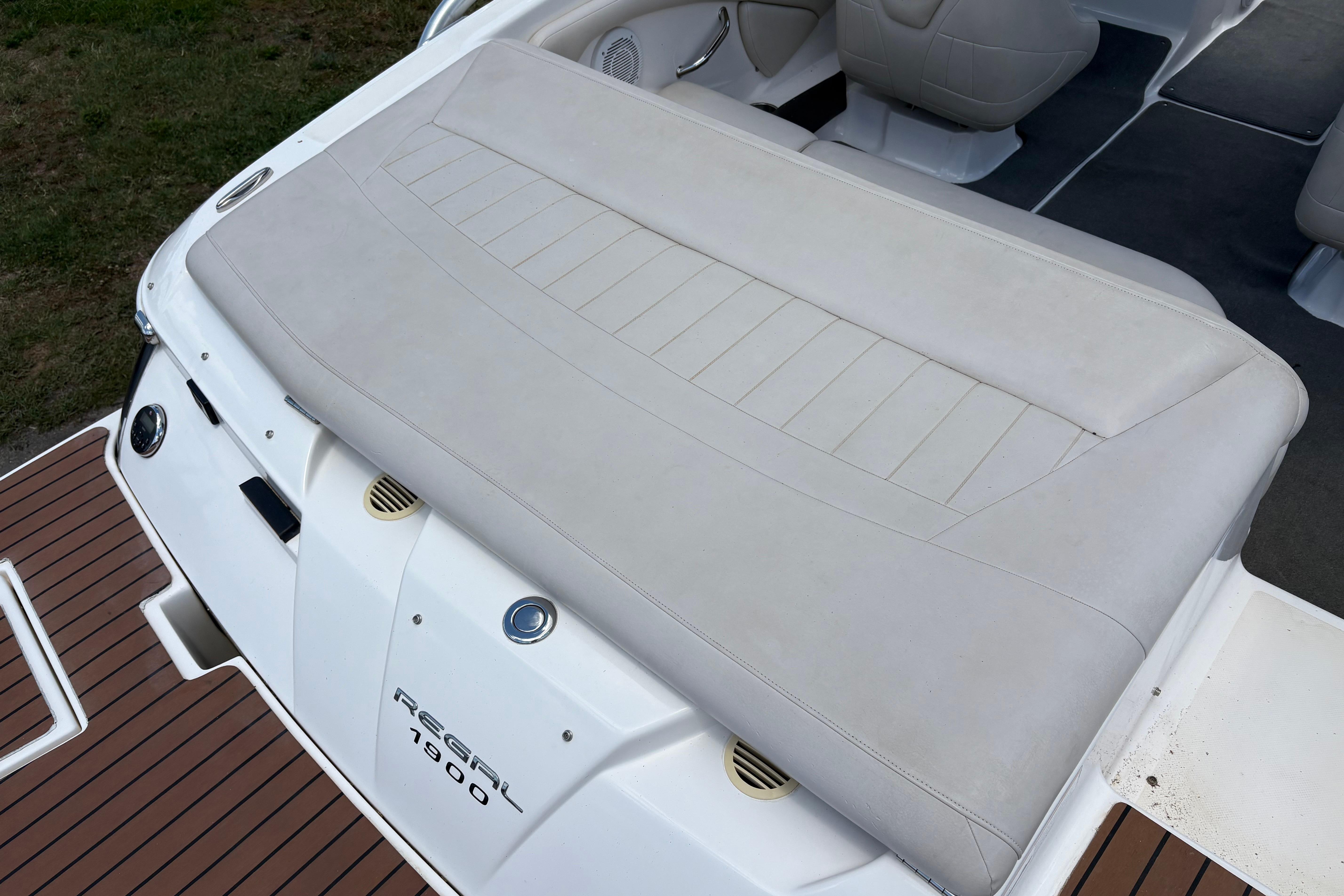 2008 Regal 1900 Bowrider boat interior with cushioned seating and teak-style flooring.
