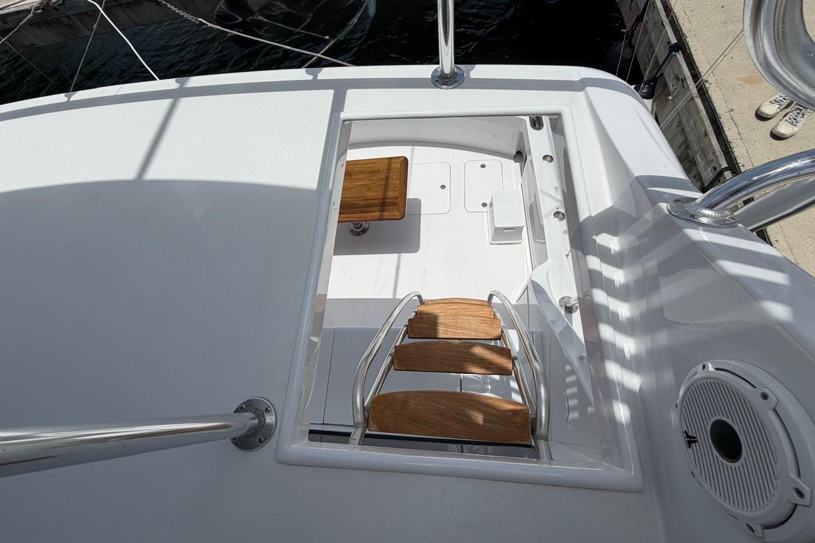 Staircase on 2003 Hatteras 54 Convertible yacht, leading to lower deck.