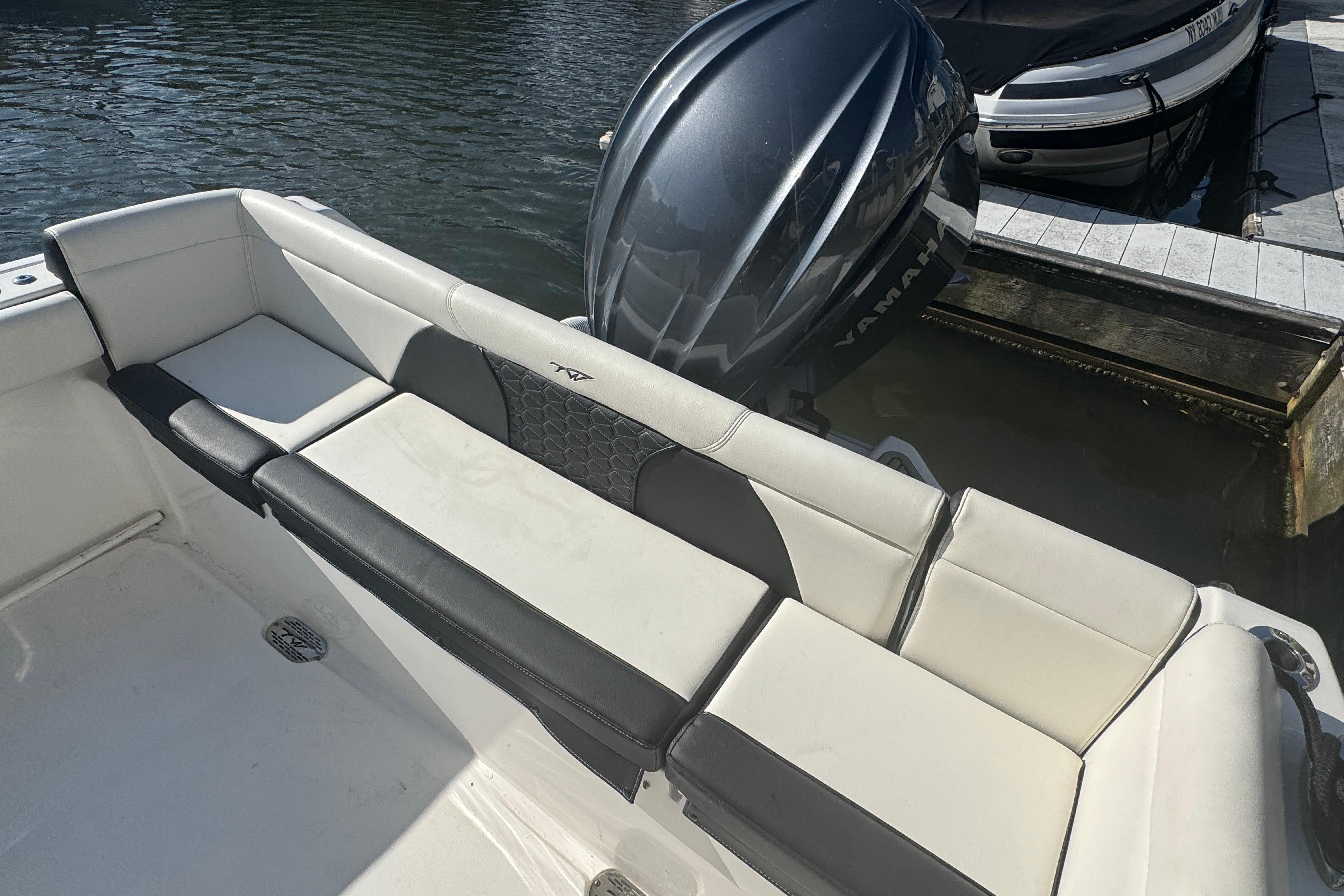 2025 Tidewater 232 LXF boat with Yamaha engine, featuring sleek seating and modern design.