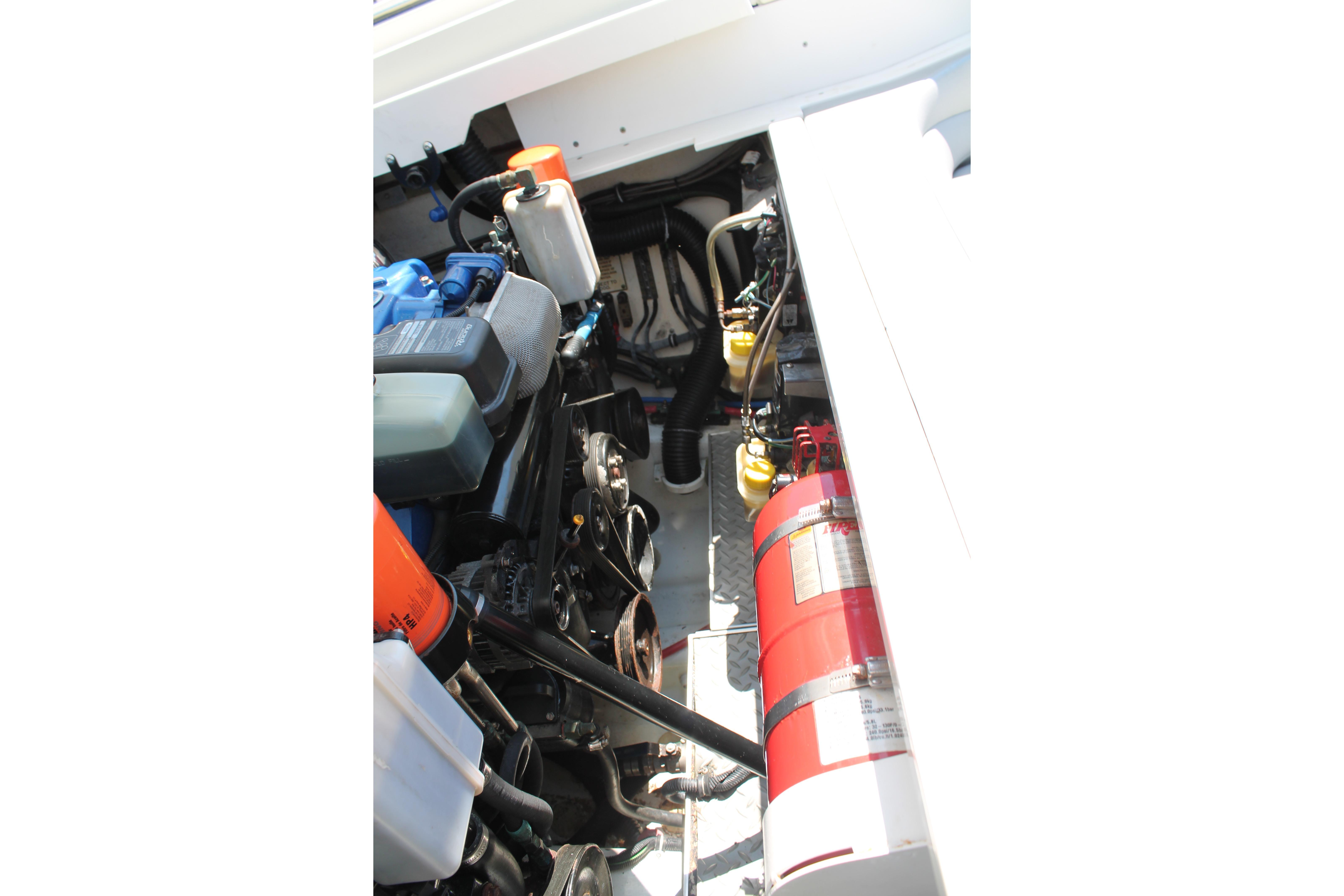 Engine compartment of a 2016 Formula 353 FASTech boat with visible components and fire extinguisher.
