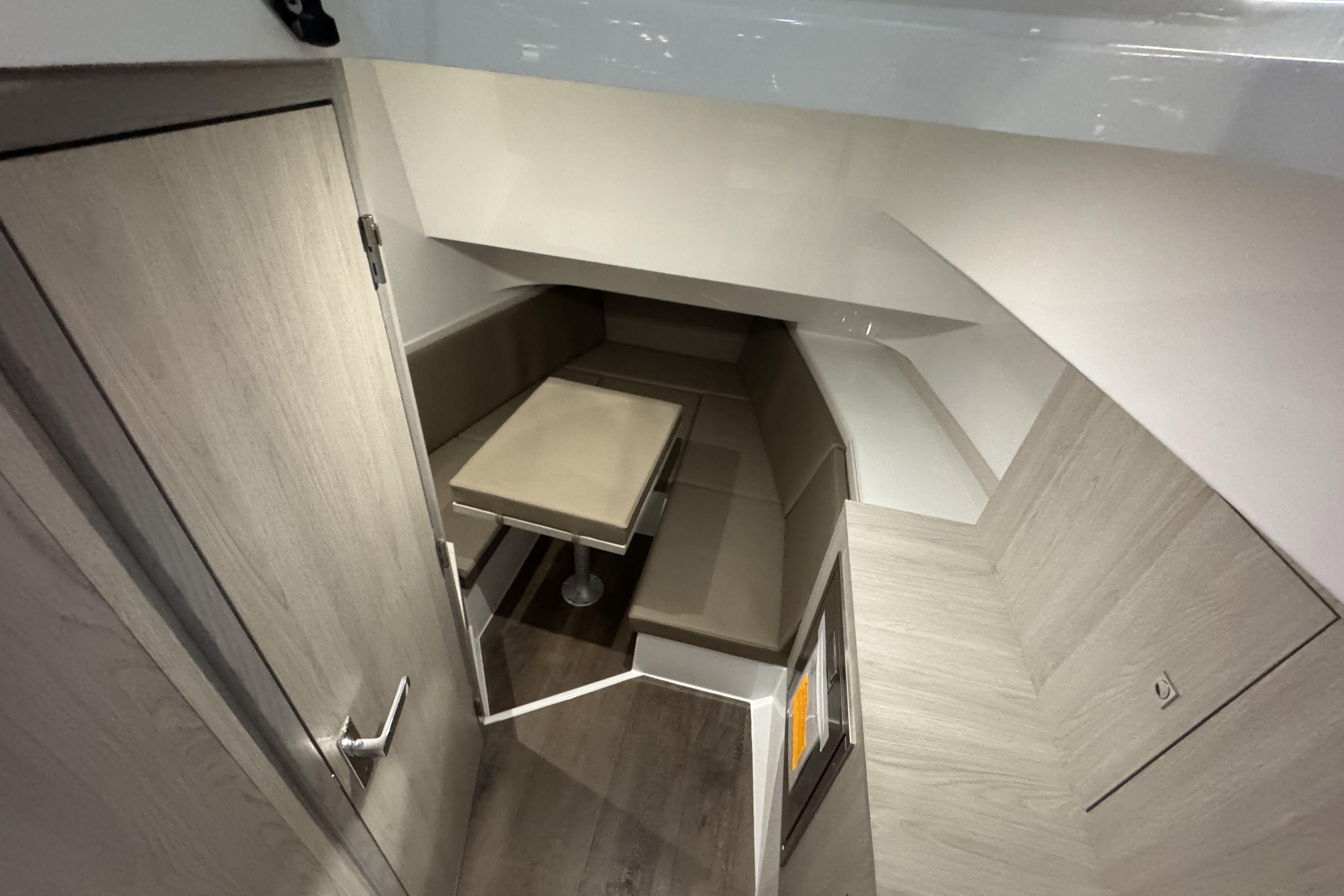 2026 Cruisers Yachts 38 VTR interior with modern seating and table arrangement.