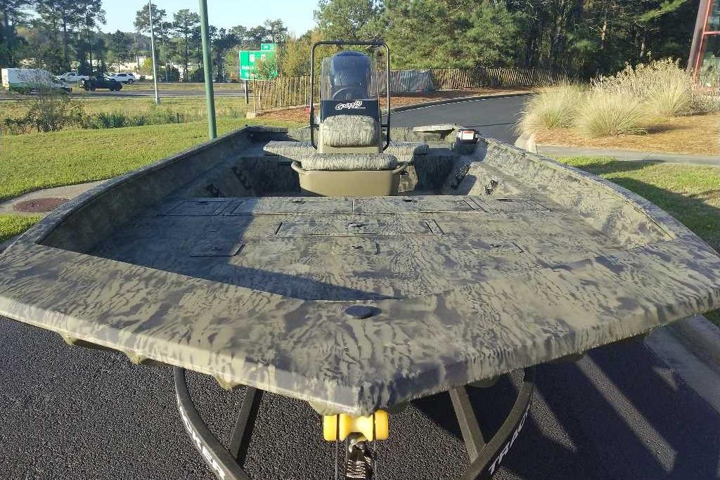 2026 Tracker Grizzly 2072 CC boat with camouflage design on a trailer.