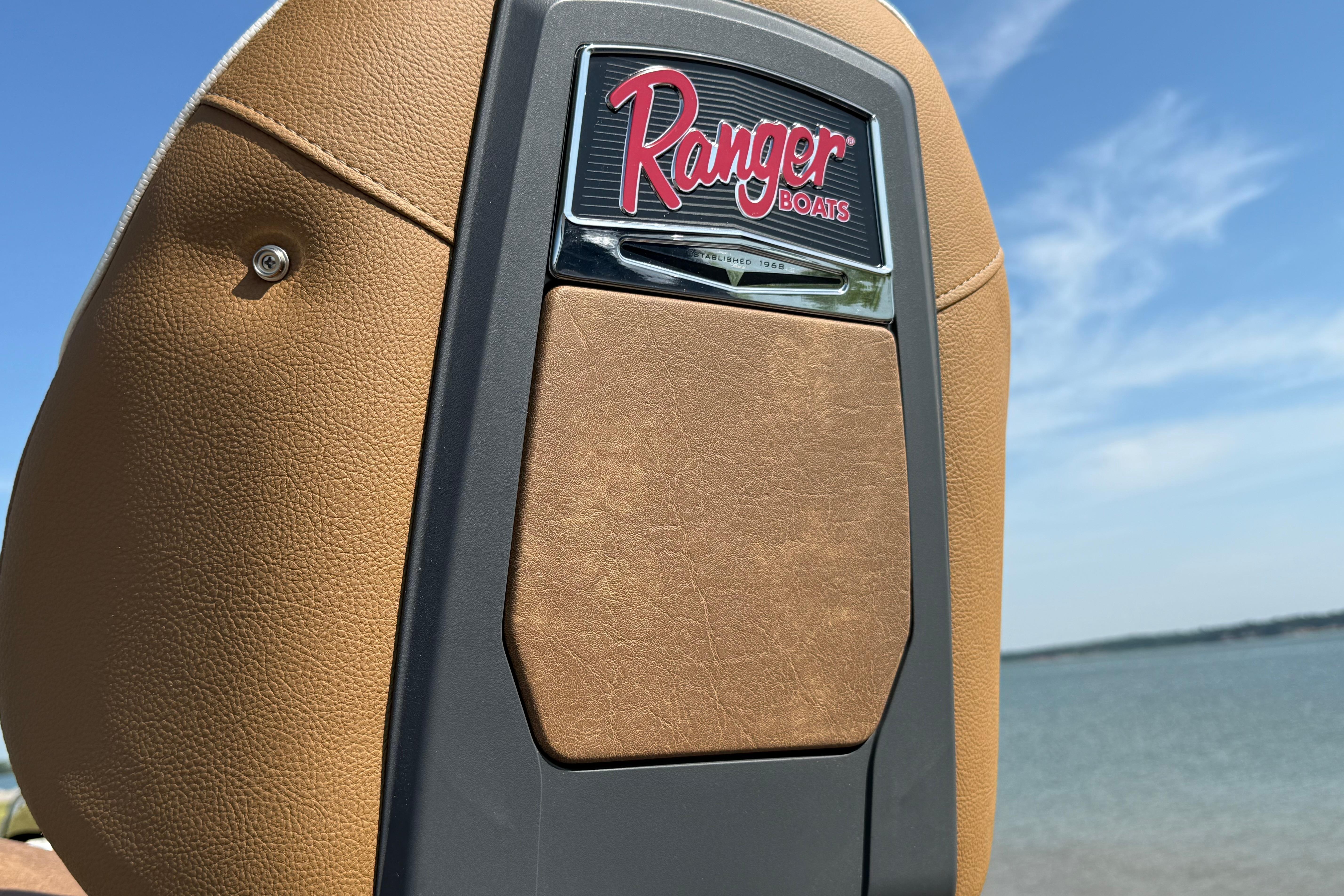 2026 Ranger Z521R boat seat with logo, against a clear blue sky and water backdrop.