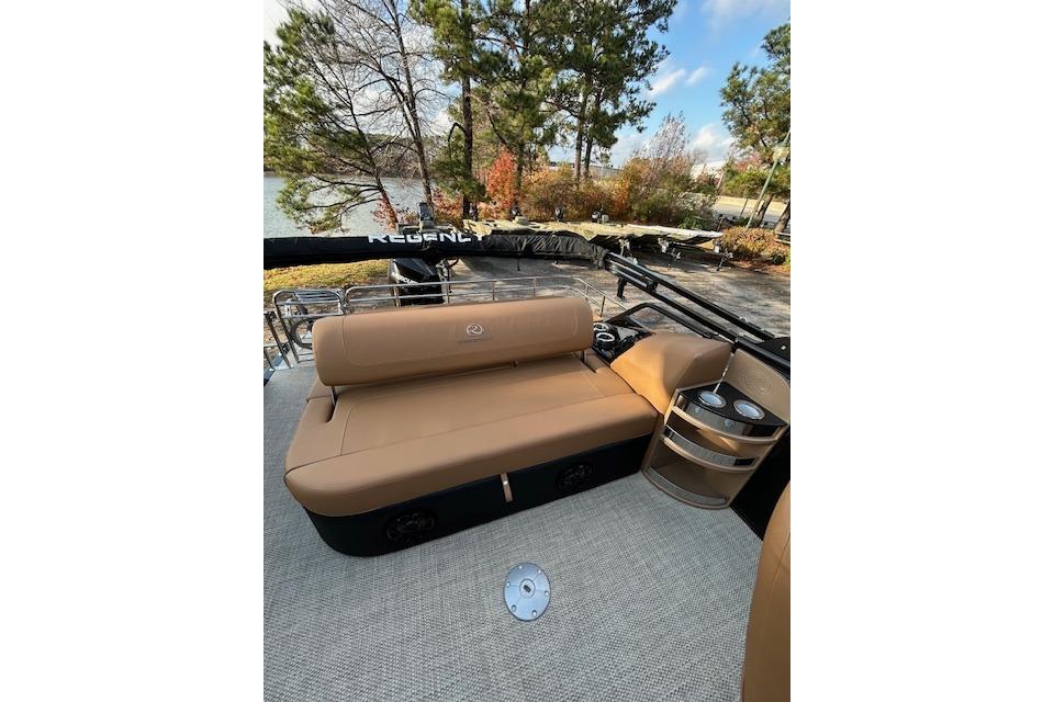 2025 Regency 230 LE3 Sport boat interior with tan seating and cup holders.