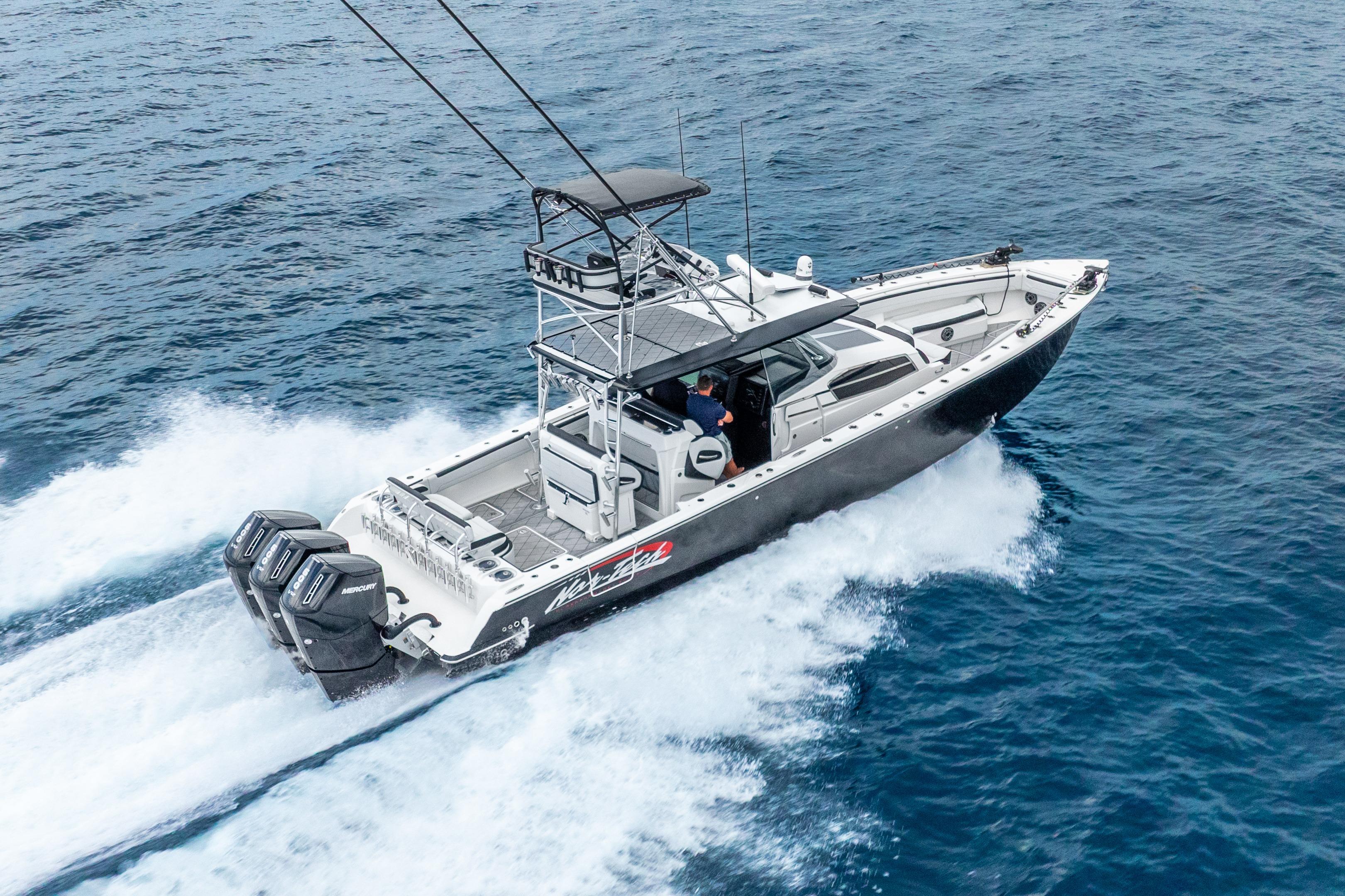 2024 Nor-Tech 452 Super Fish boat cruising on open water, showcasing powerful engines.