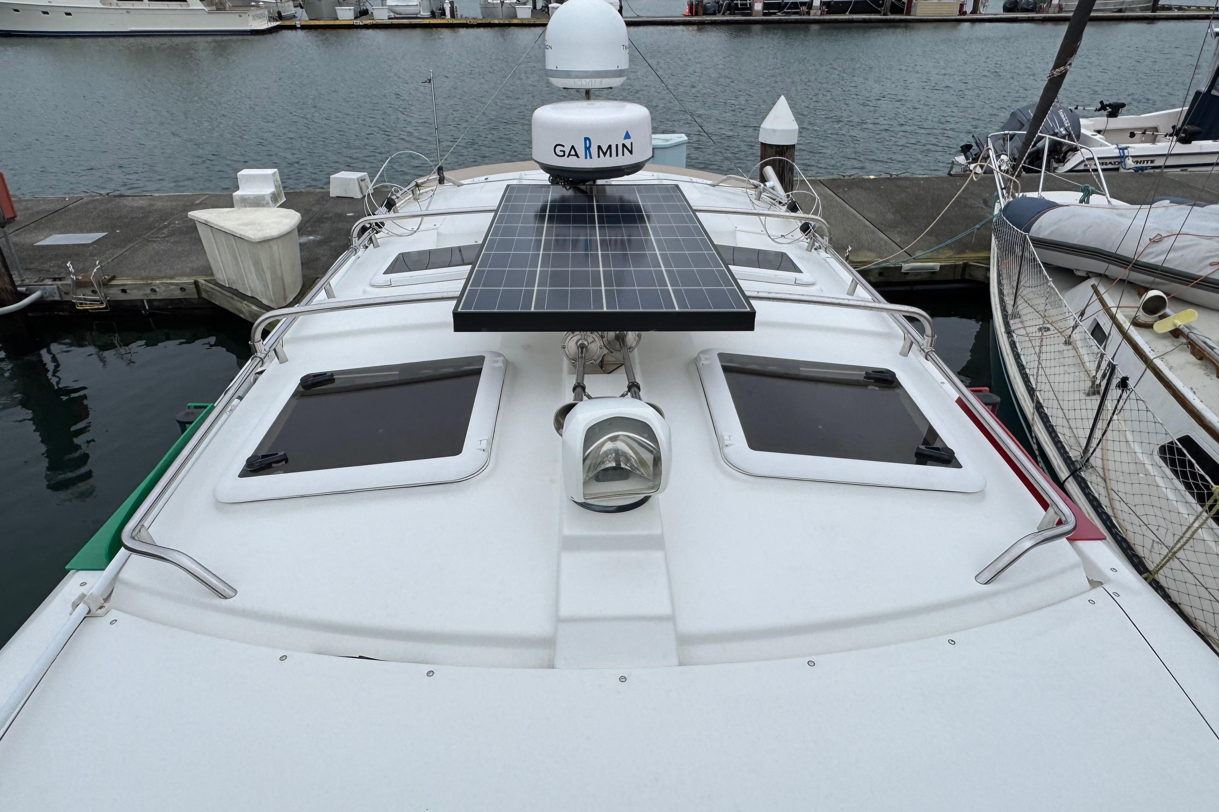 2014 Cutwater 28 boat with solar panel and Garmin radar at dock.