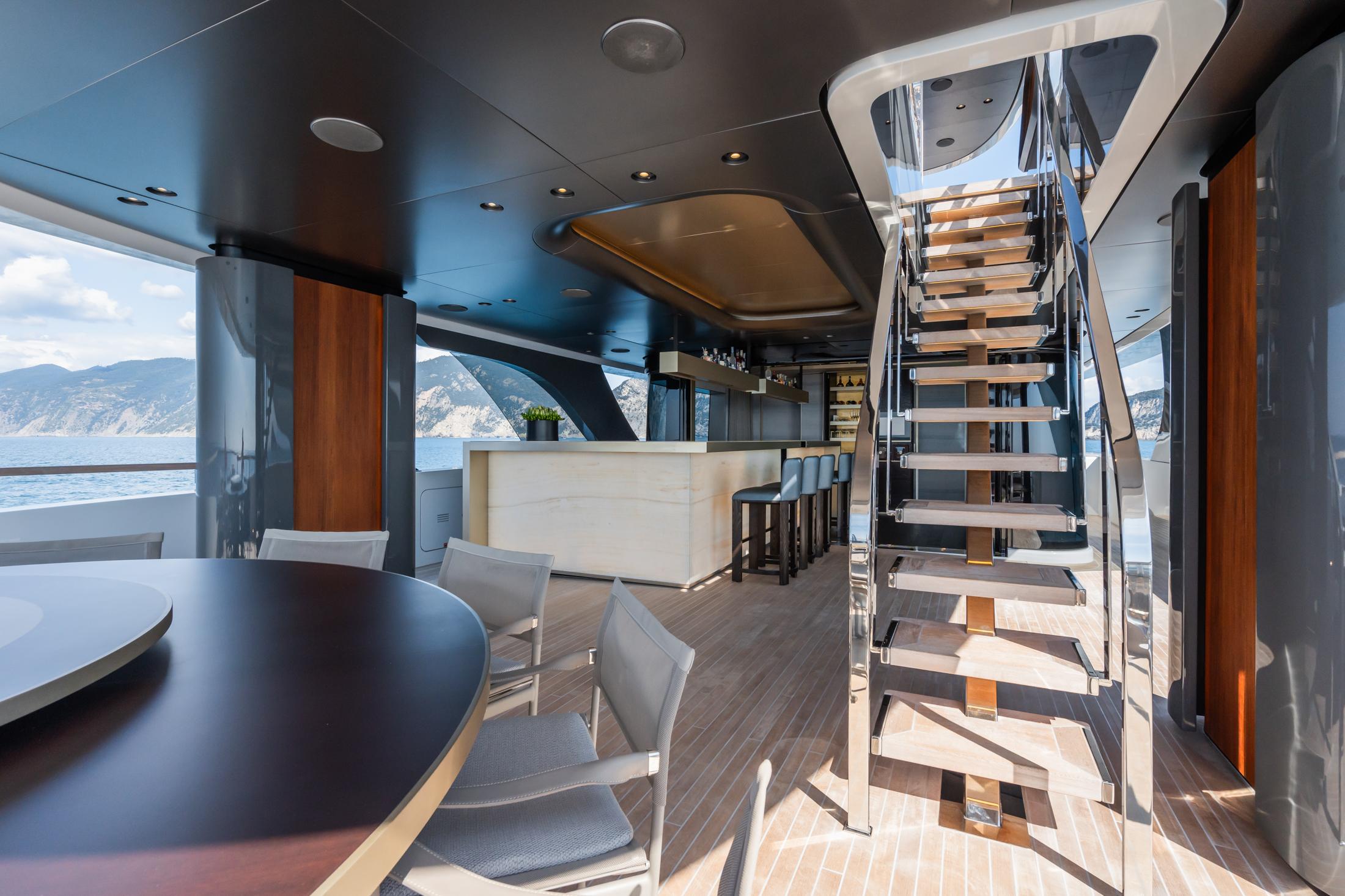 Luxurious interior of 2023 Admiral 55 S-Force yacht with modern design and scenic ocean view.