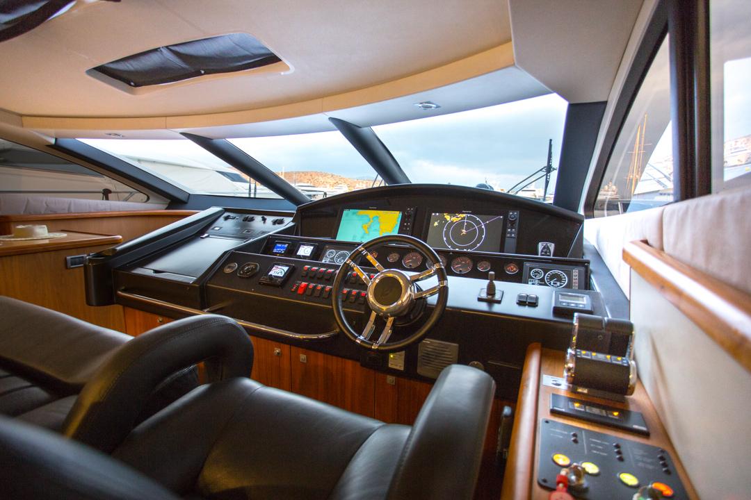 Luxurious 2009 Sunseeker Predator 72 yacht cockpit with advanced navigation controls.