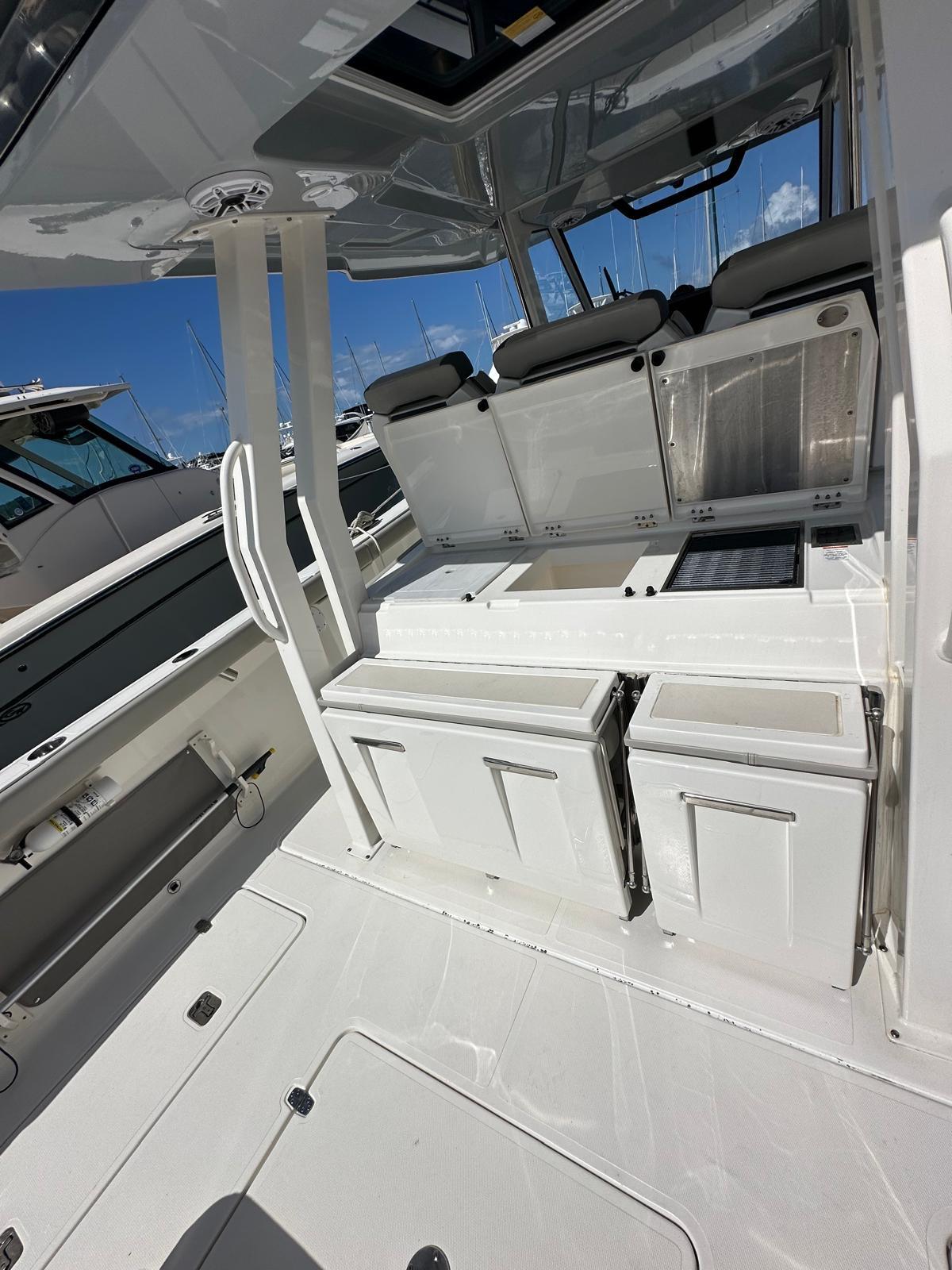 2023 Pursuit S 358 Sport boat interior with sleek white design and modern amenities.