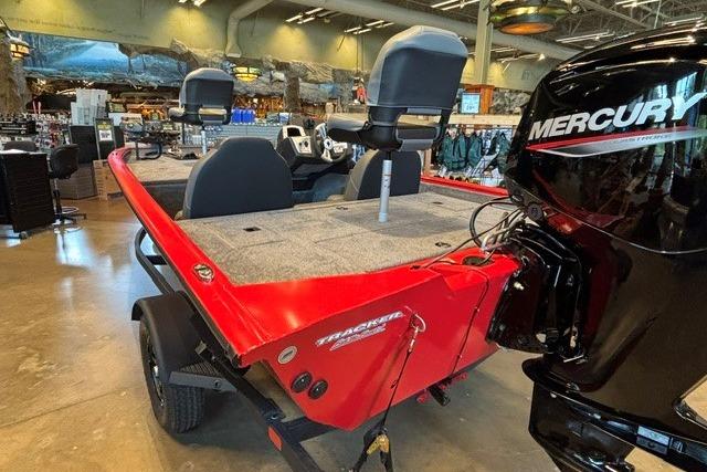 2026 Tracker Pro Team 175 boat with Mercury engine, displayed indoors.