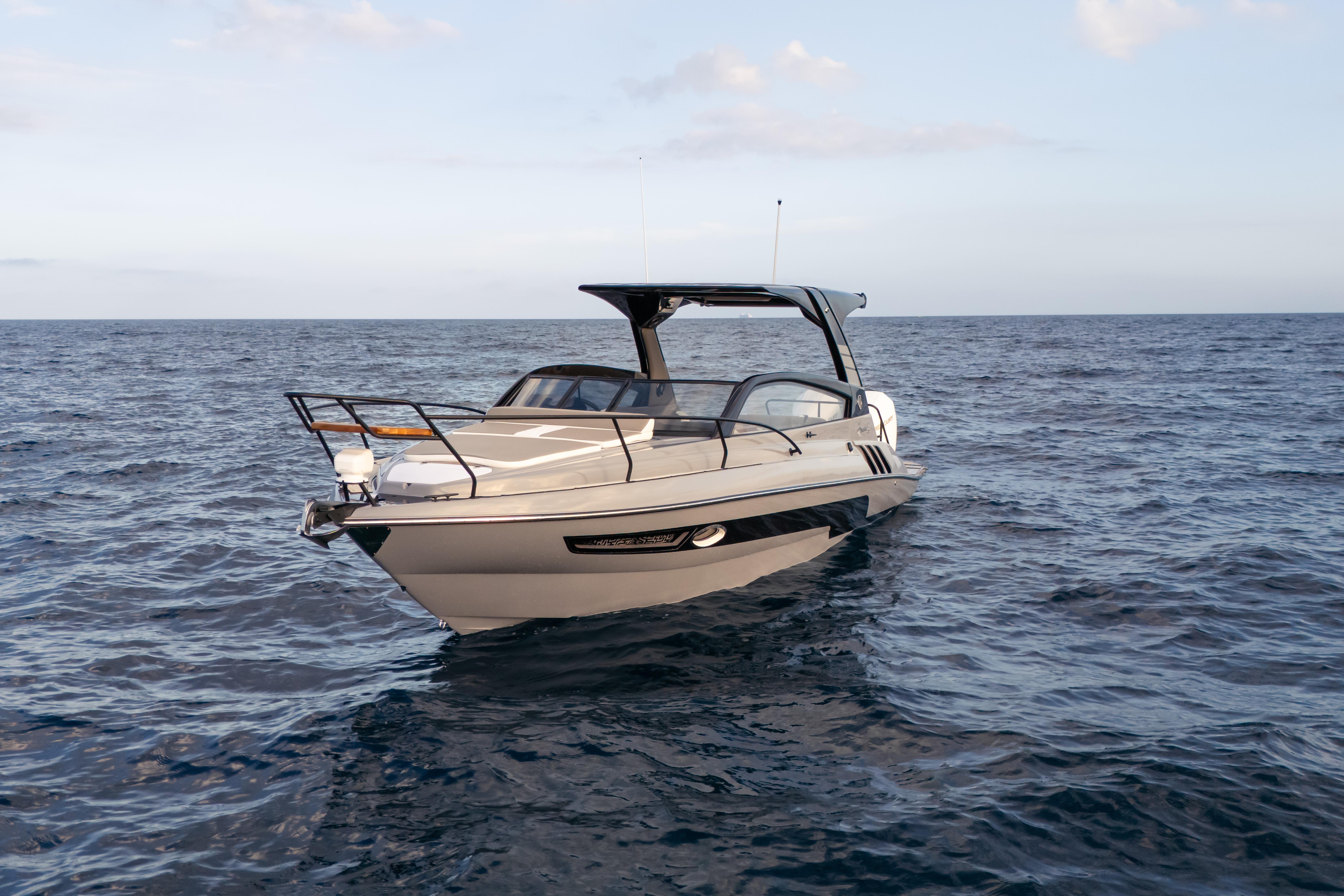 Modern Hanover 305 boat on open sea, 2026 model, sleek design, calm waters.