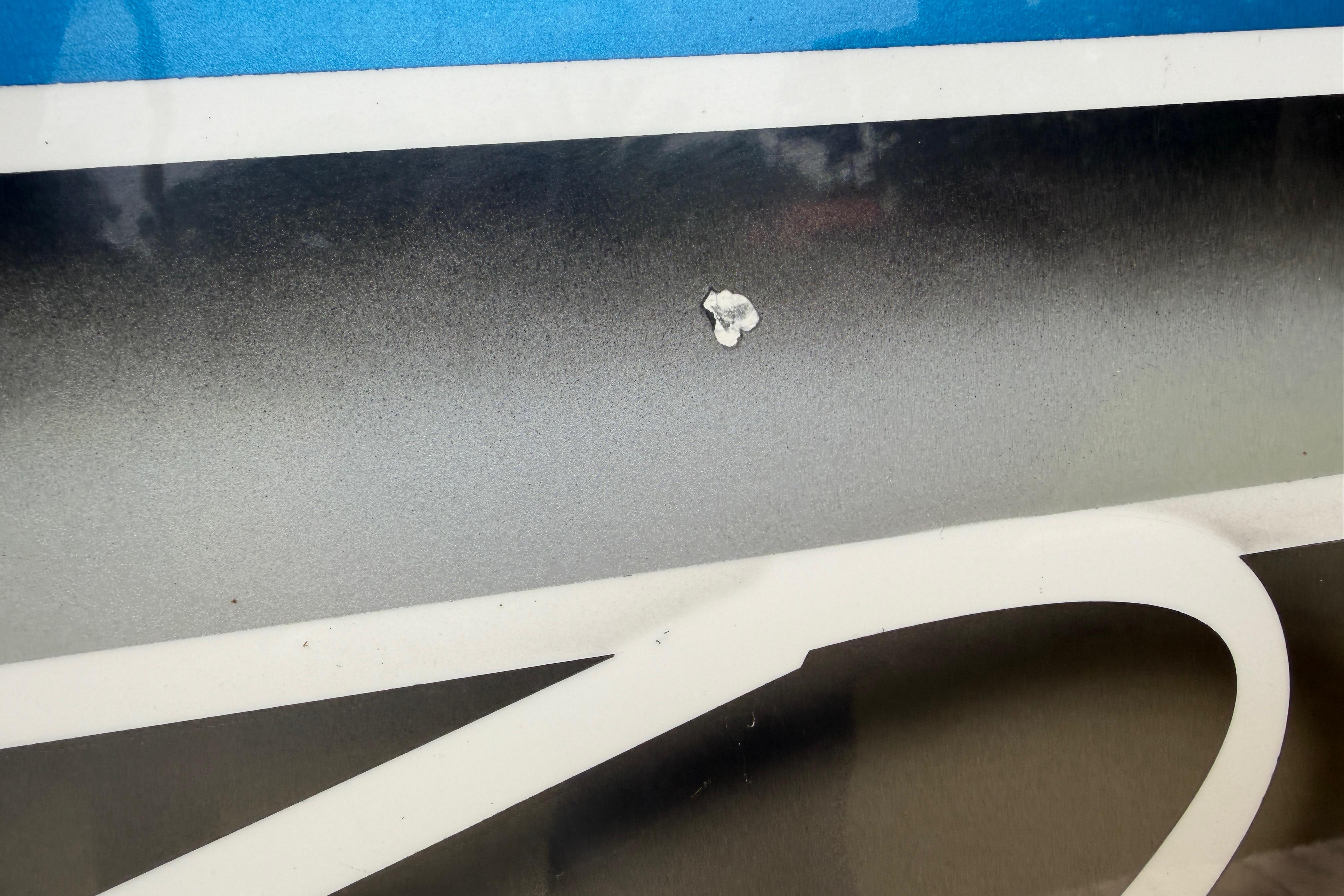Close-up of 2013 Nor-Tech 477 SPX Vee Bottom boat with minor hull damage.