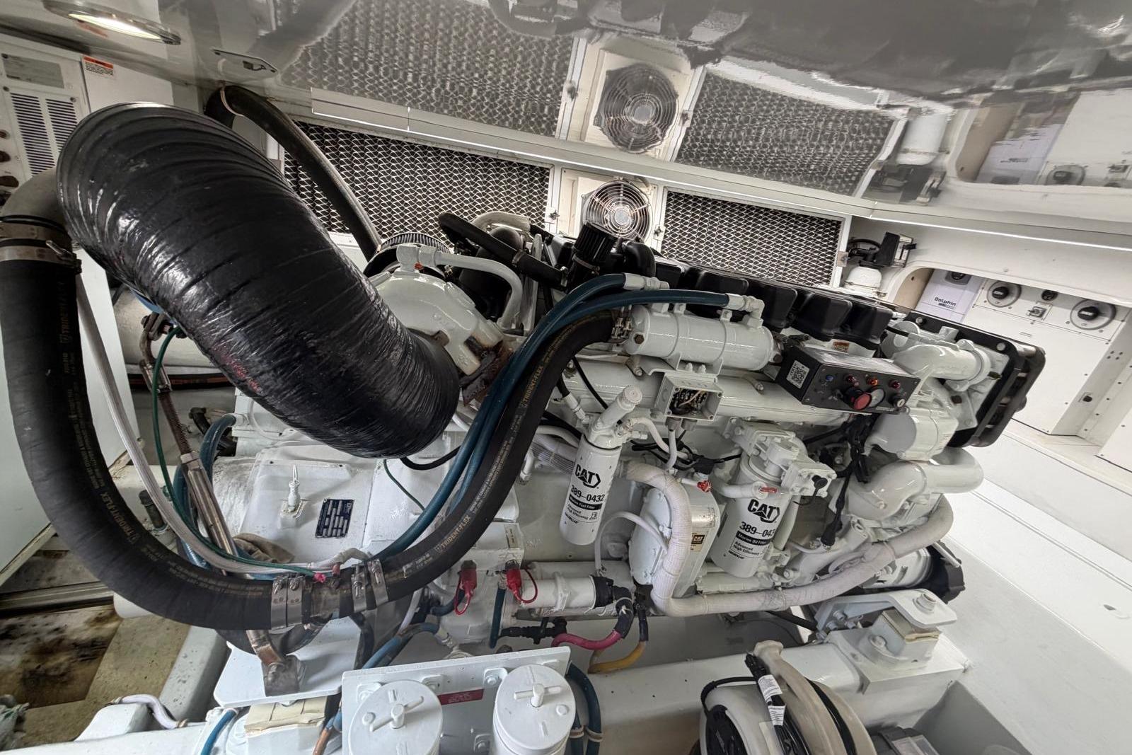 Engine room of 2003 Hatteras 54 Convertible yacht, featuring CAT machinery and components.