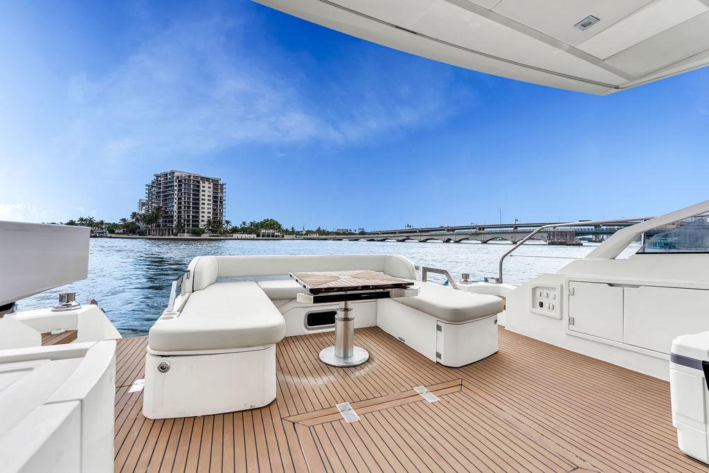 Luxurious 2012 Fairline Targa 58 yacht deck with scenic waterfront view.