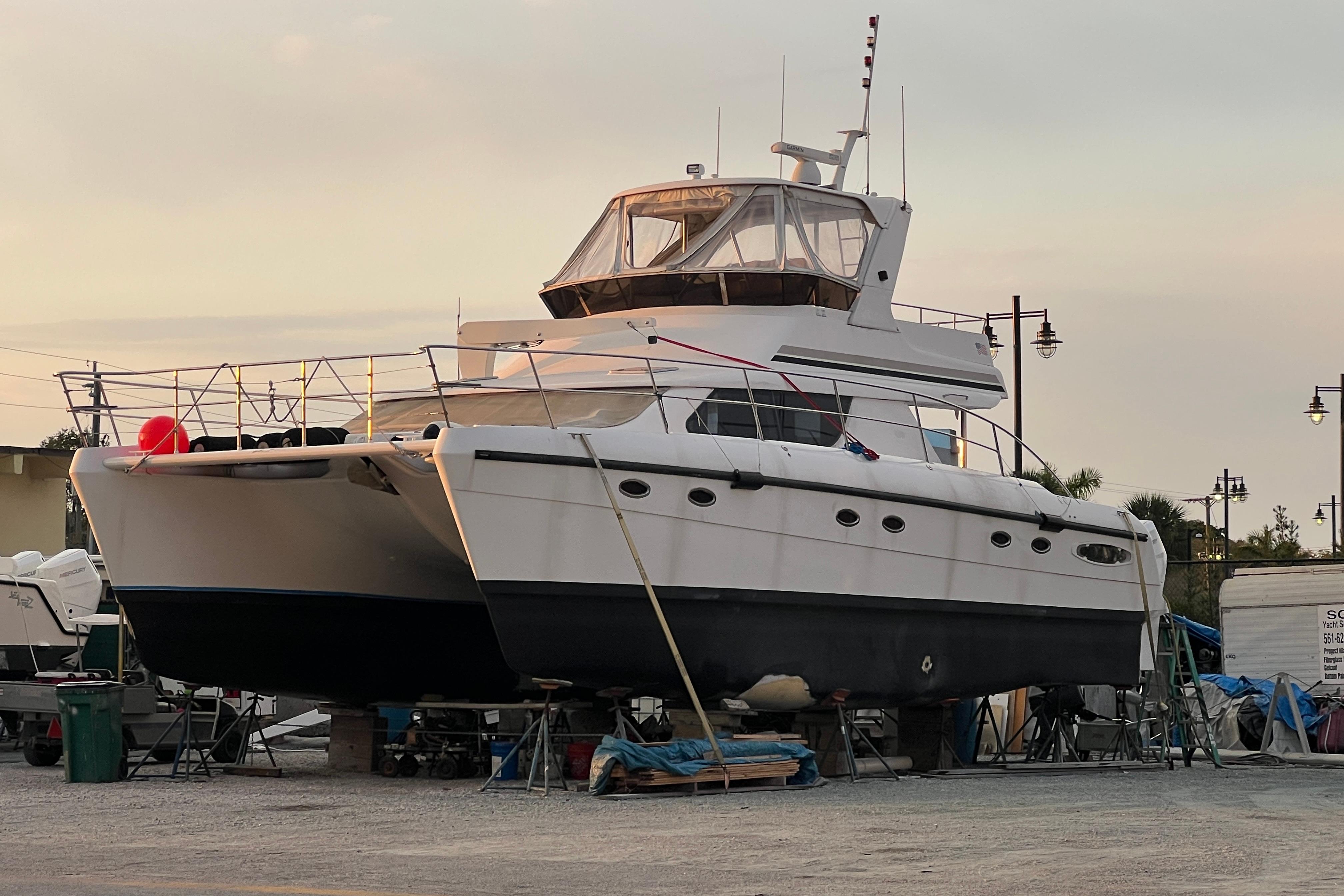 2009 Africat Marine 420 yacht on dry dock at sunset.