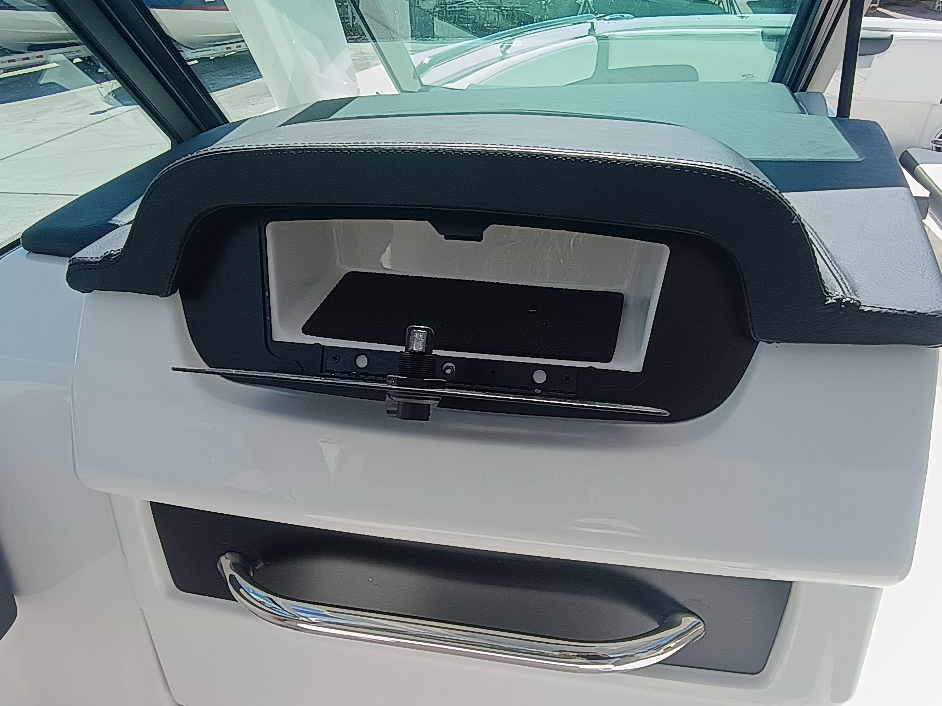 2025 Robalo R257 Dual Console dashboard with storage compartment and handle.