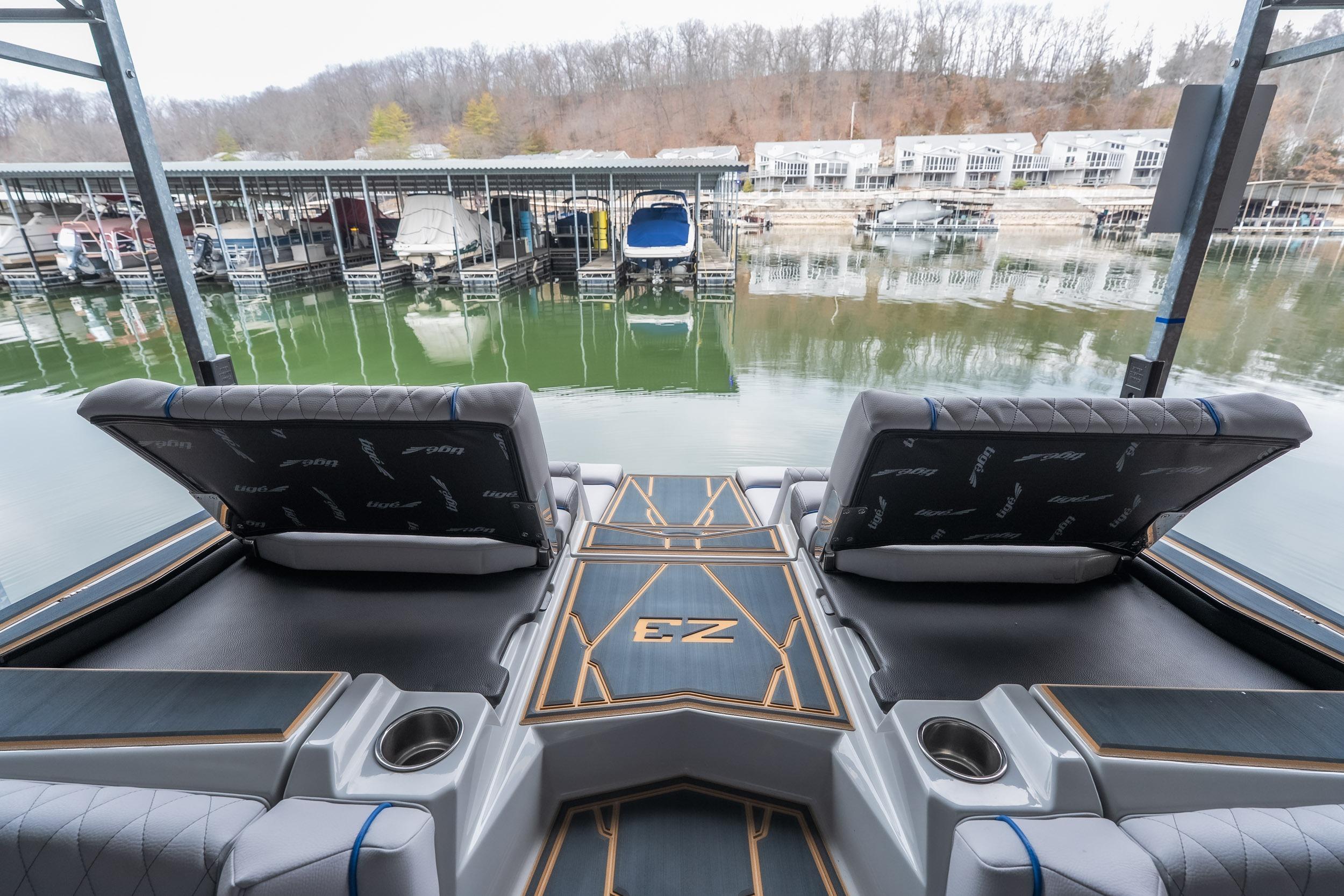 2026 Tigé Z3 boat interior with luxurious seating at a marina.