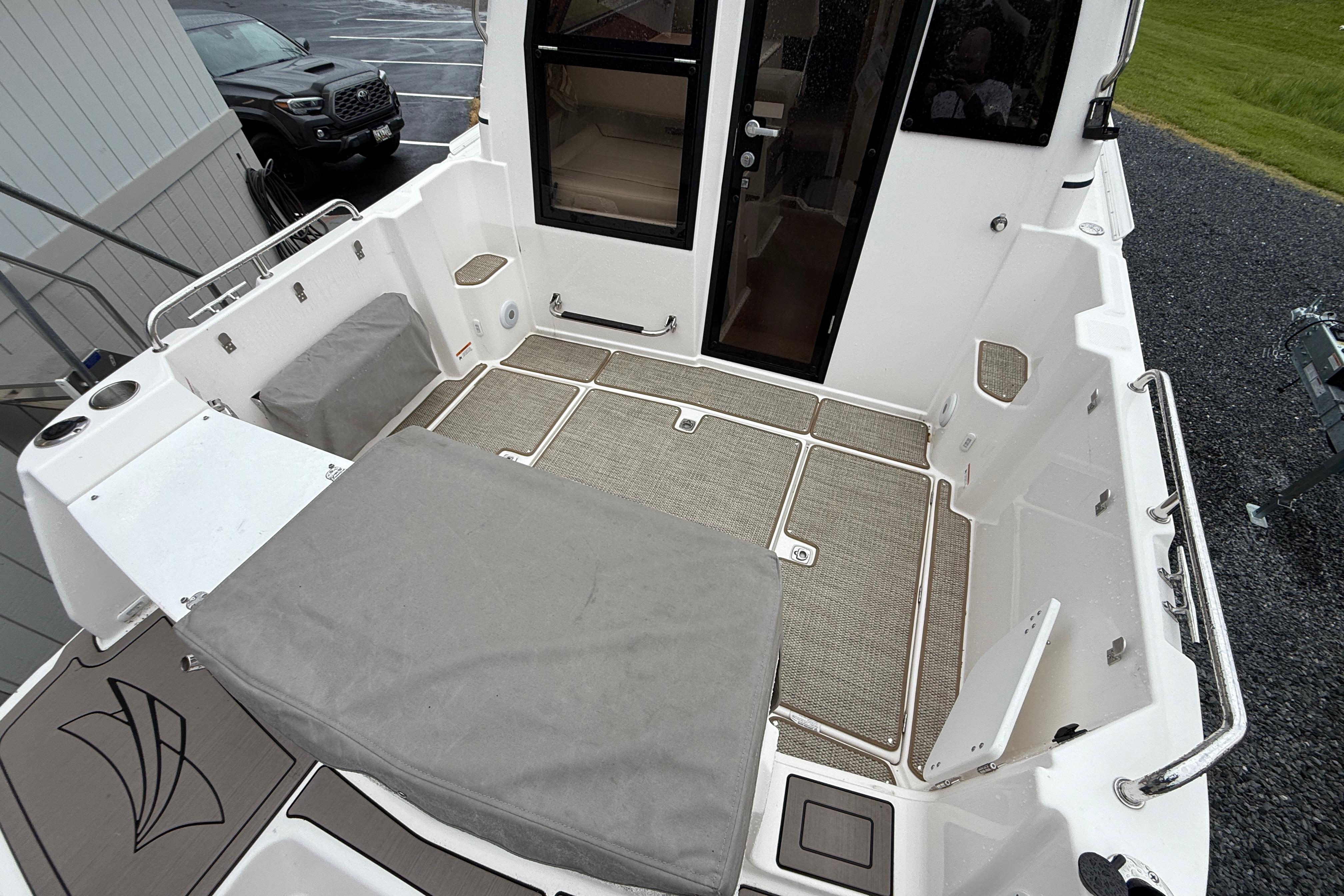 2026 Cutwater C-248 Coupe boat deck with seating and storage compartments.
