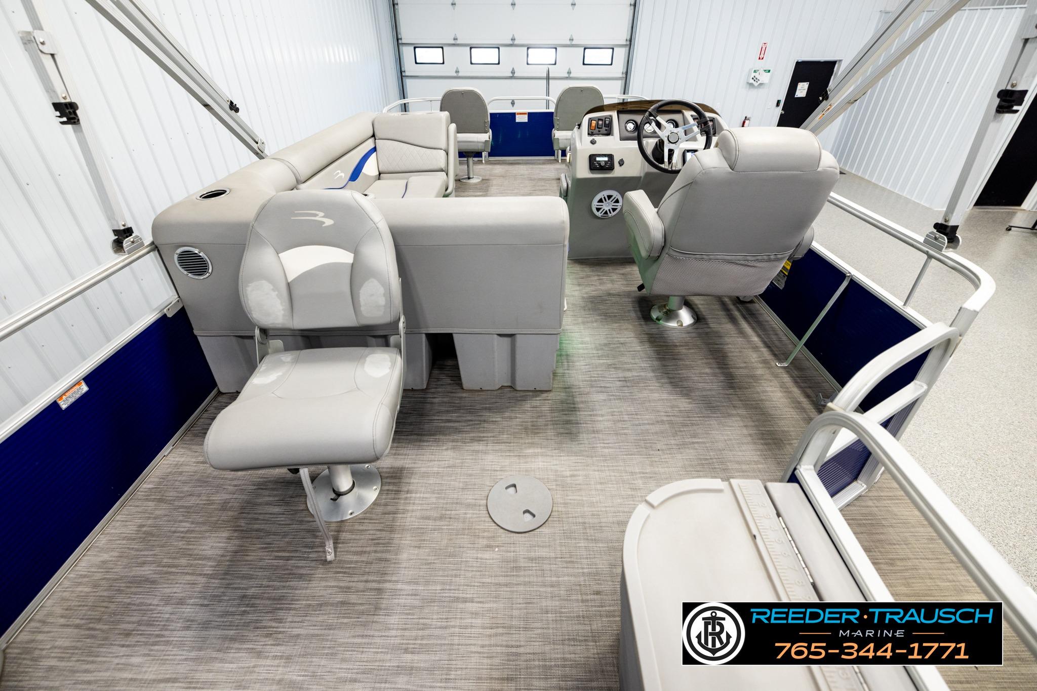 2021 Bennington 20 SV pontoon boat interior with gray seating and steering console.