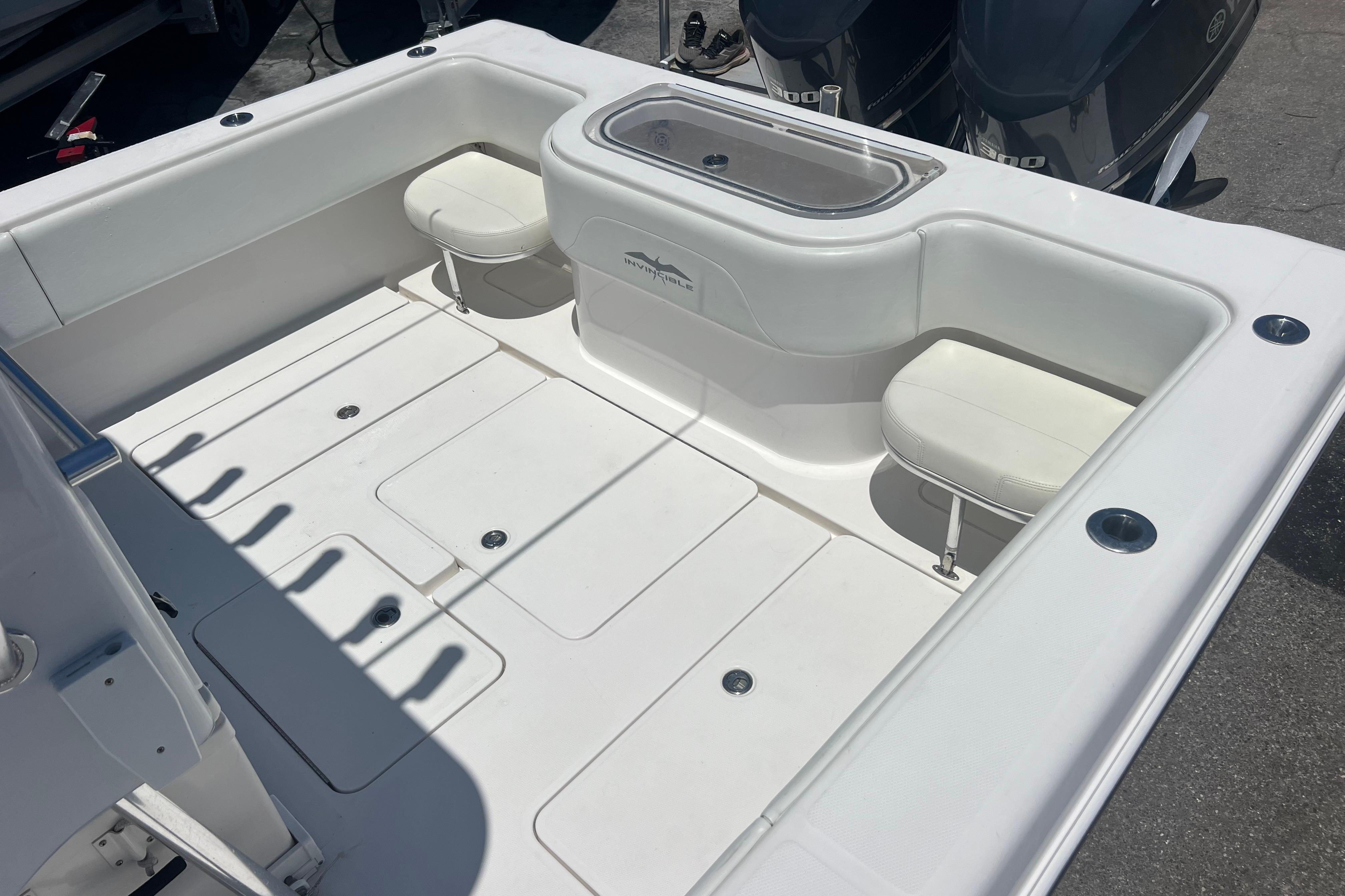 2012 Invincible 33 Open Fisherman boat interior with seating and storage compartments.