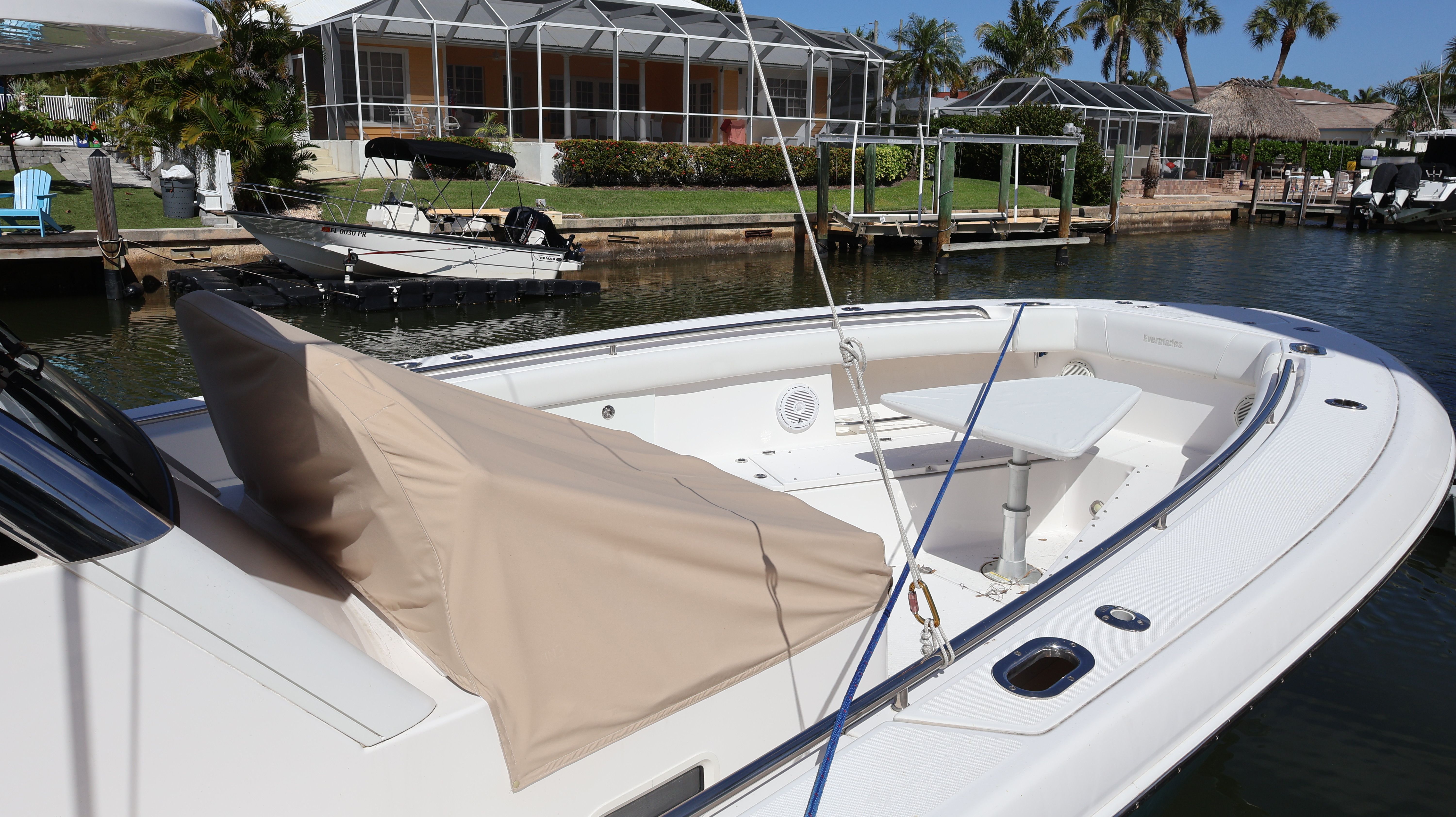 2019 Everglades 435 Center Console boat at dock.