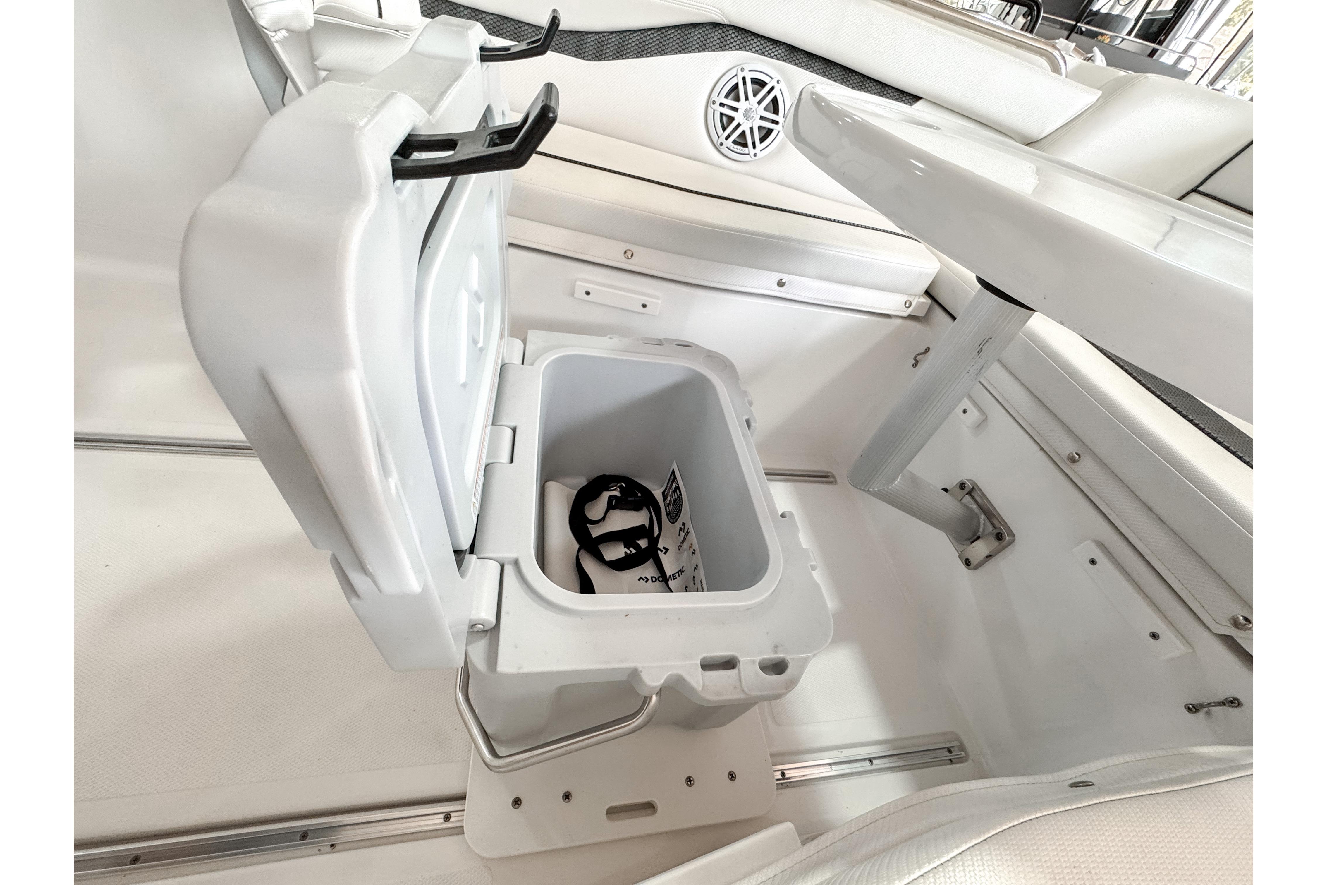 2024 Wellcraft 263 Fisherman boat interior with open storage compartment.